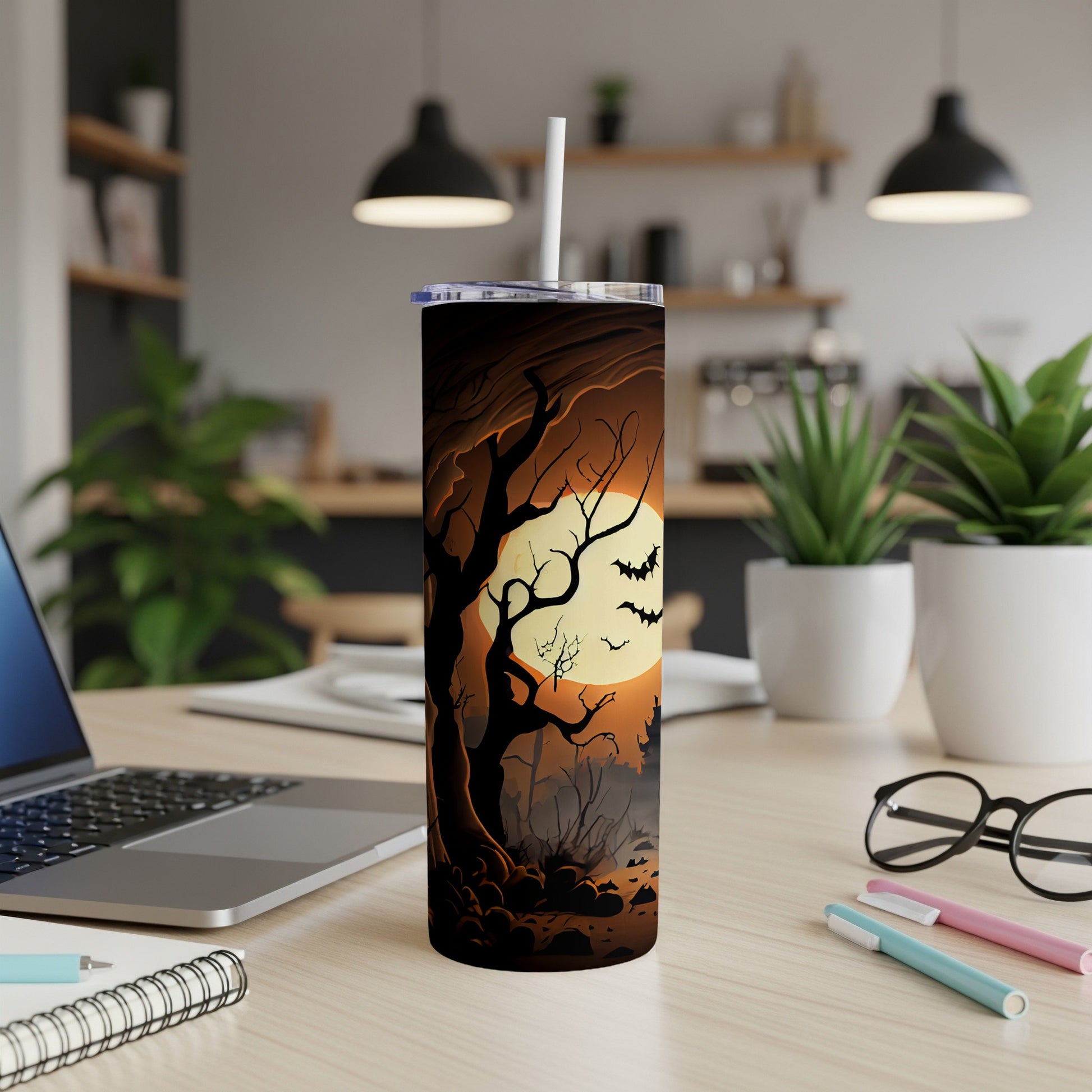 Halloween tumbler with spooky trees, bats, and full moon design.