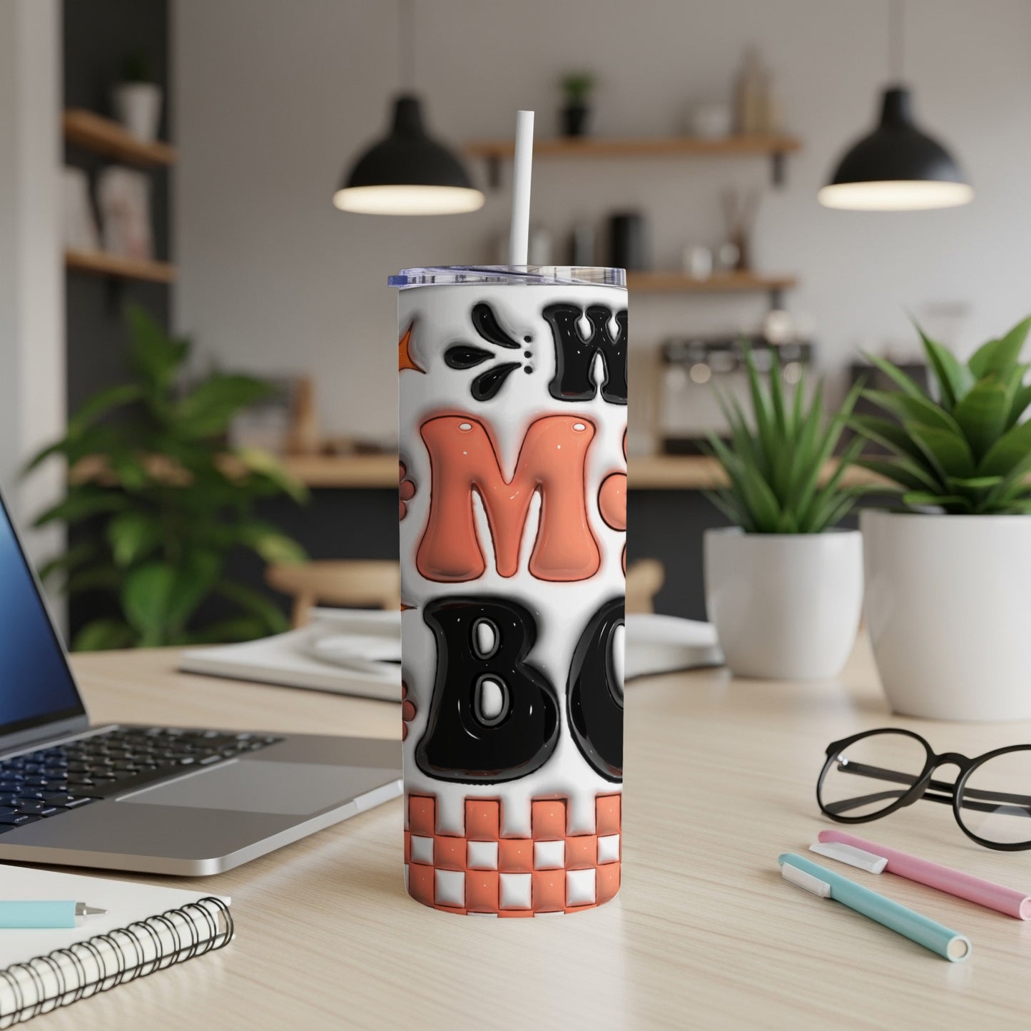 "Mom Boss" tumbler with orange, white, and black lettering on a checkered base.