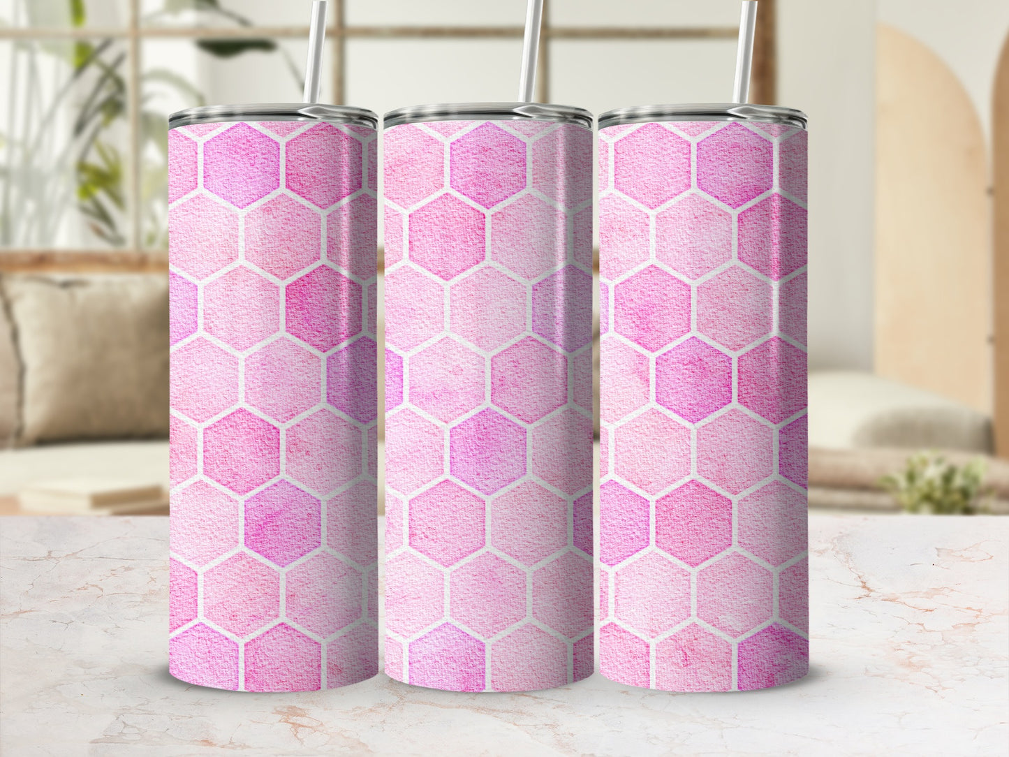 Three pink hexagon pattern tumblers with white straws, displayed in a row.