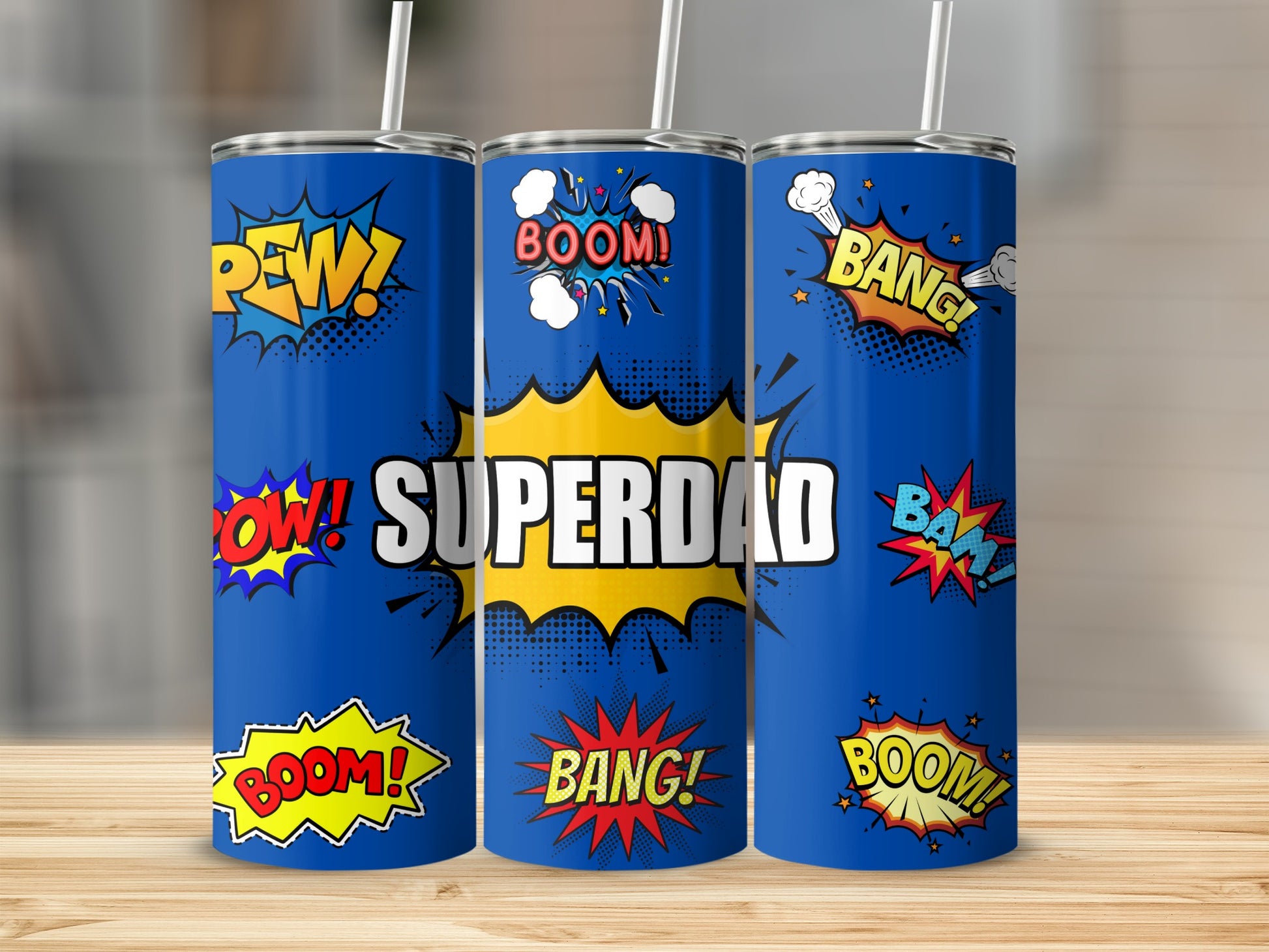 Blue tumblers with comic book style "Superdad" graphic and sound effects.