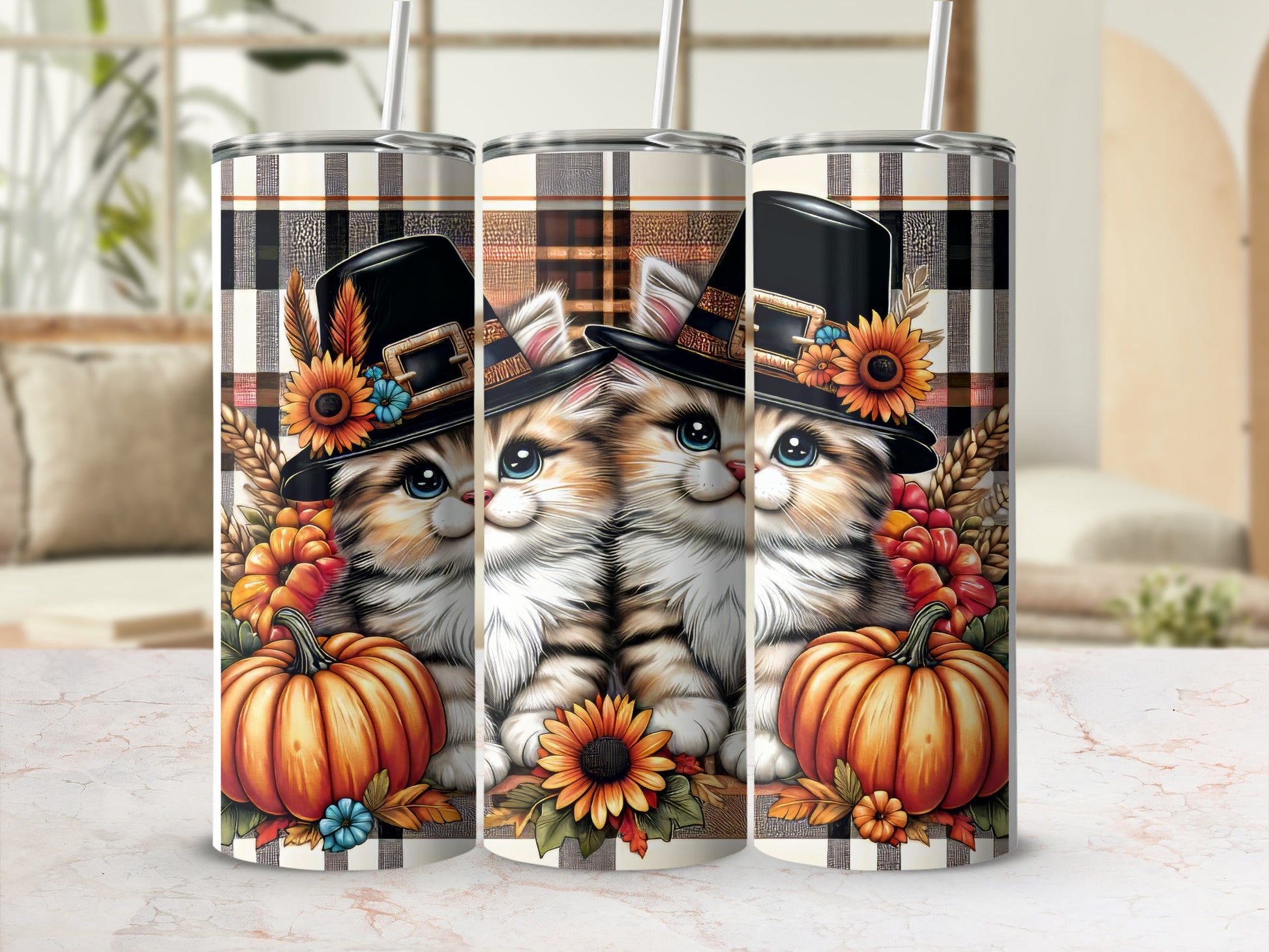 Three tumblers with cute cats in fall hats and pumpkins.