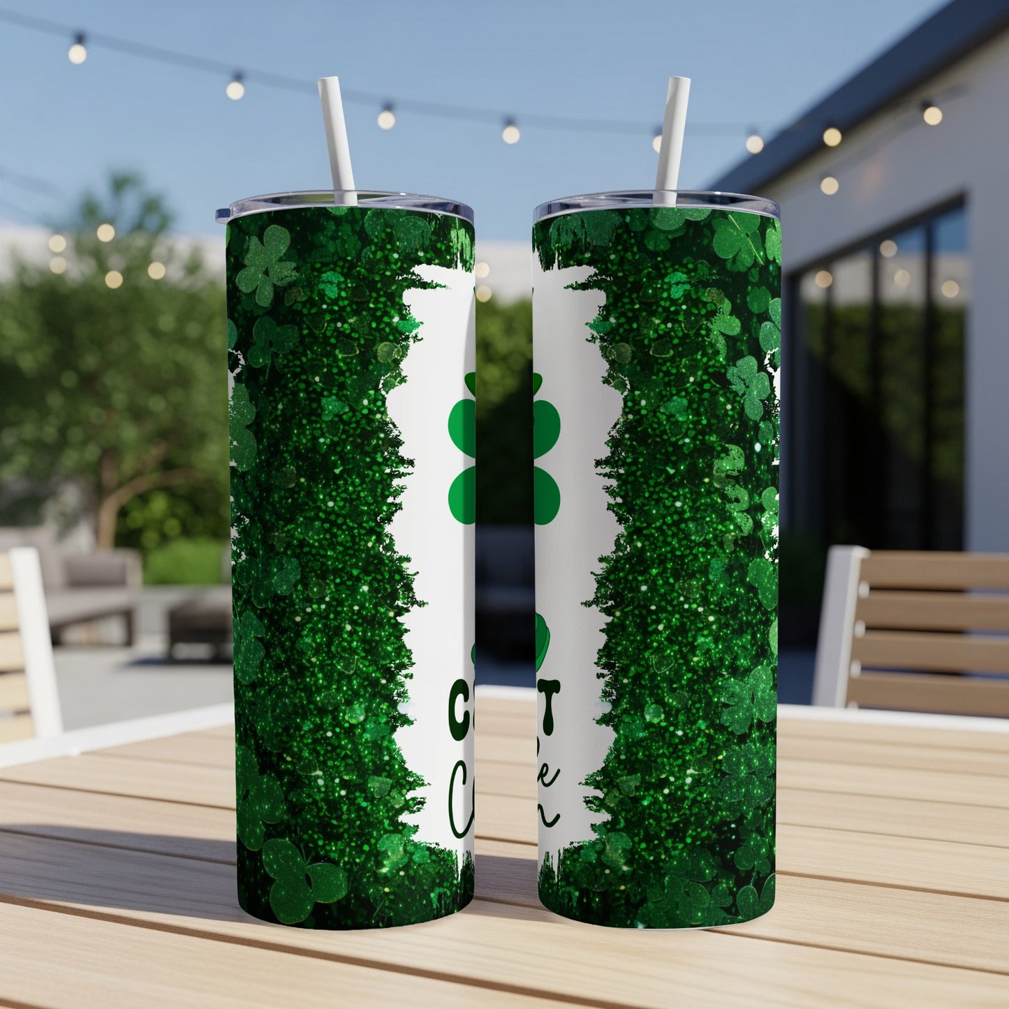 Green glitter shamrock tumbler with "Cute as a button" text.
