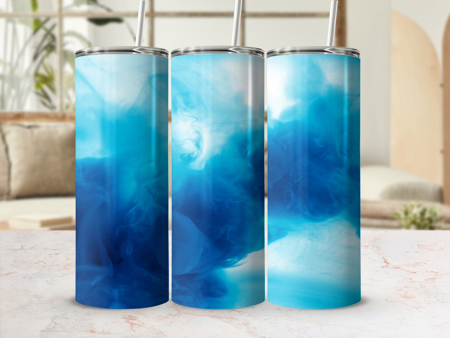 Three tumblers with swirling blue abstract smoke patterns.