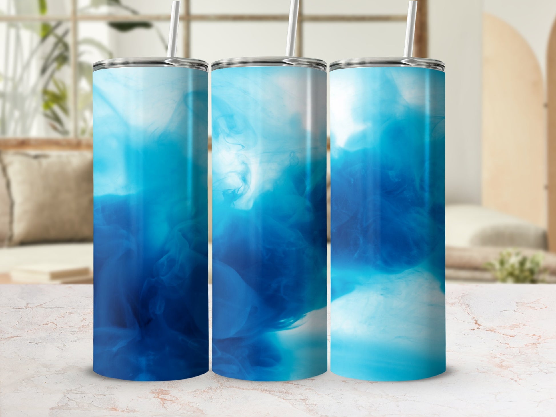 Three tumblers with swirling blue abstract smoke patterns.