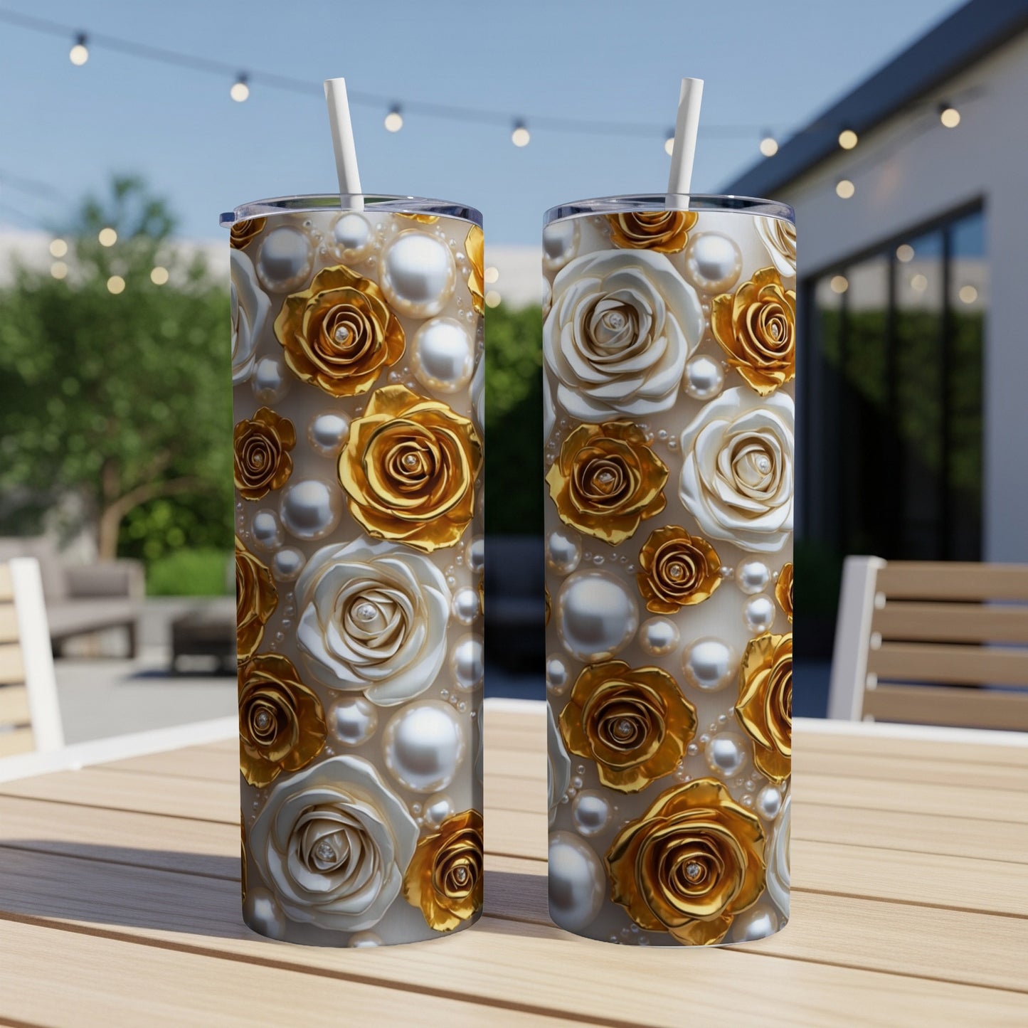 Two tumblers with floral and pearl patterns on a table.
