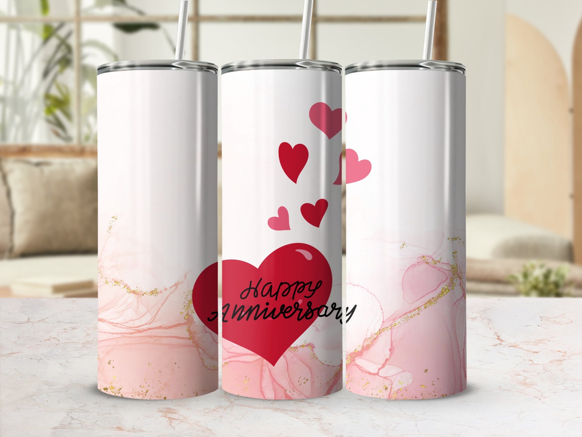 Tumbler with red hearts and "Happy Anniversary" text on pink marbled background.