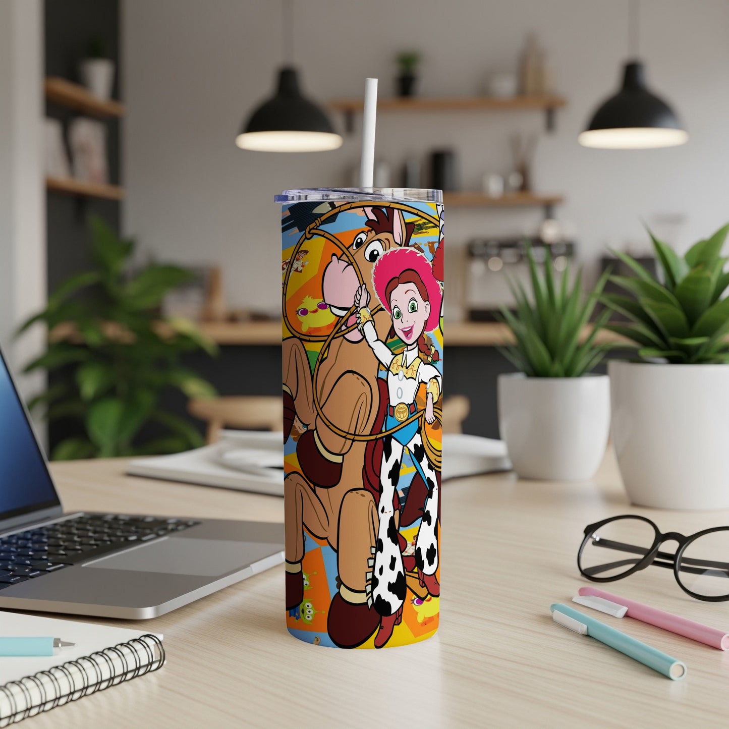 Woody and Jessie from Toy Story on a colorful tumbler with straw.
