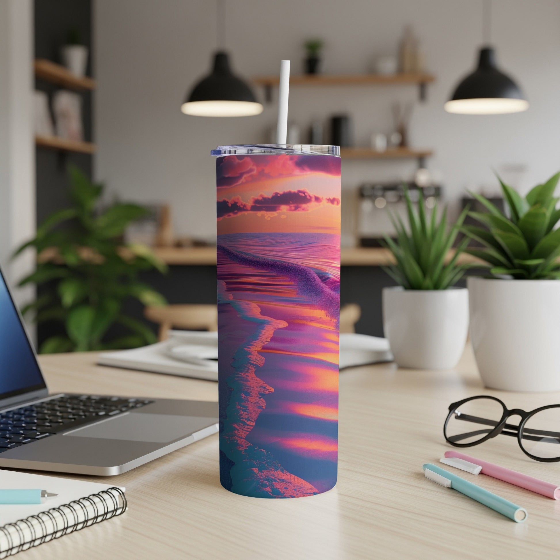 Beach sunset design on a stainless steel tumbler with a white straw.