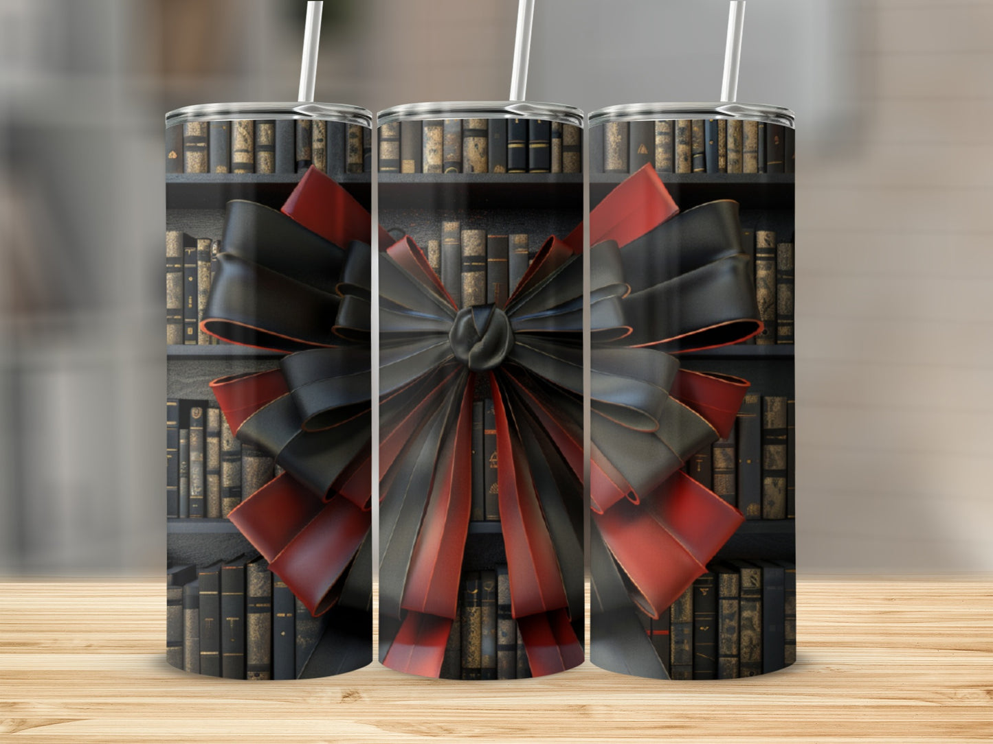 Triptych of tumblers decorated with a black and red bow in front of a bookshelf.