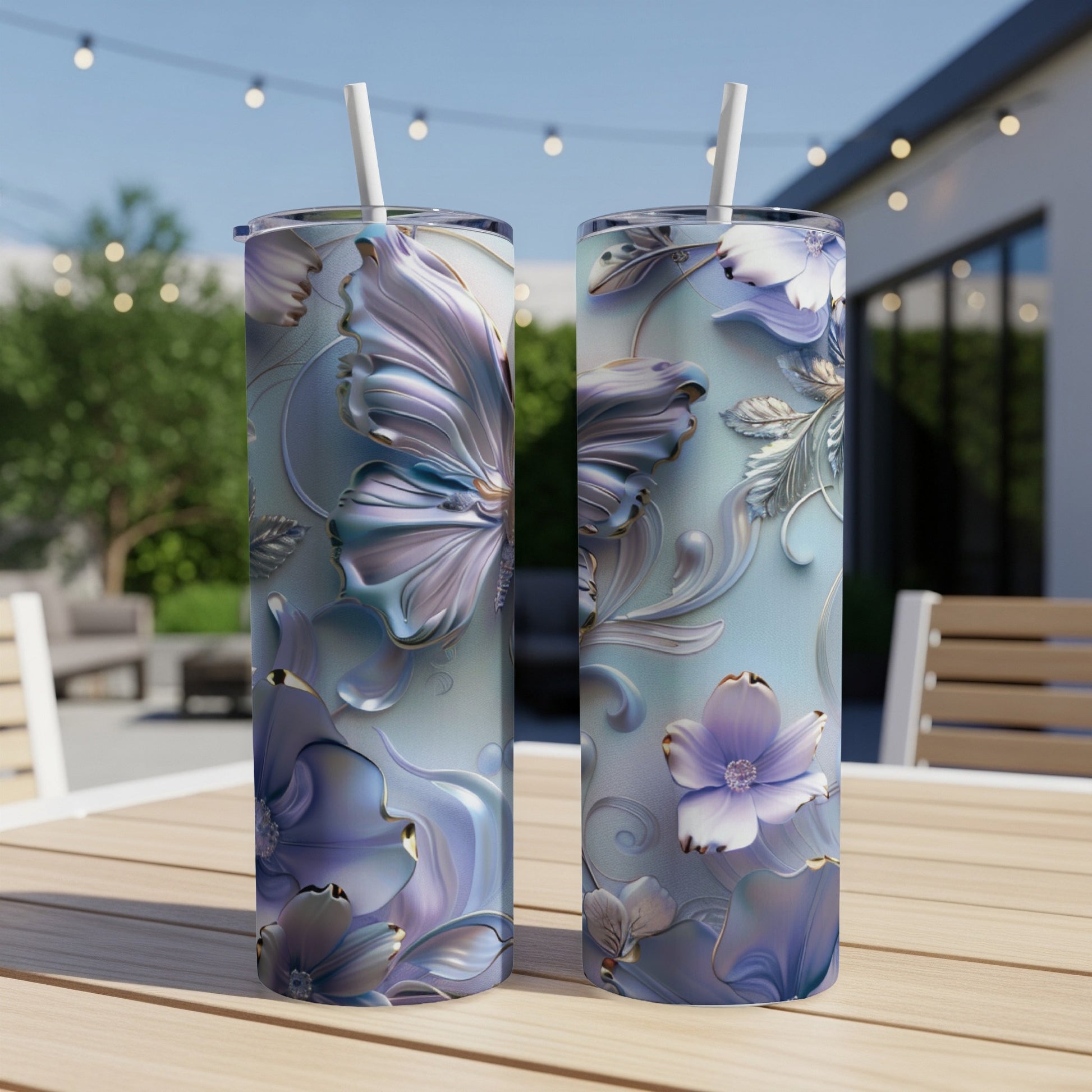 Two tall, slim tumblers with intricate floral and butterfly designs.