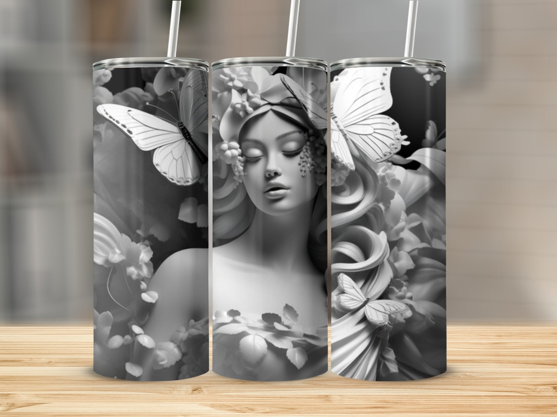 Black and white tumbler with woman and butterfly floral design.