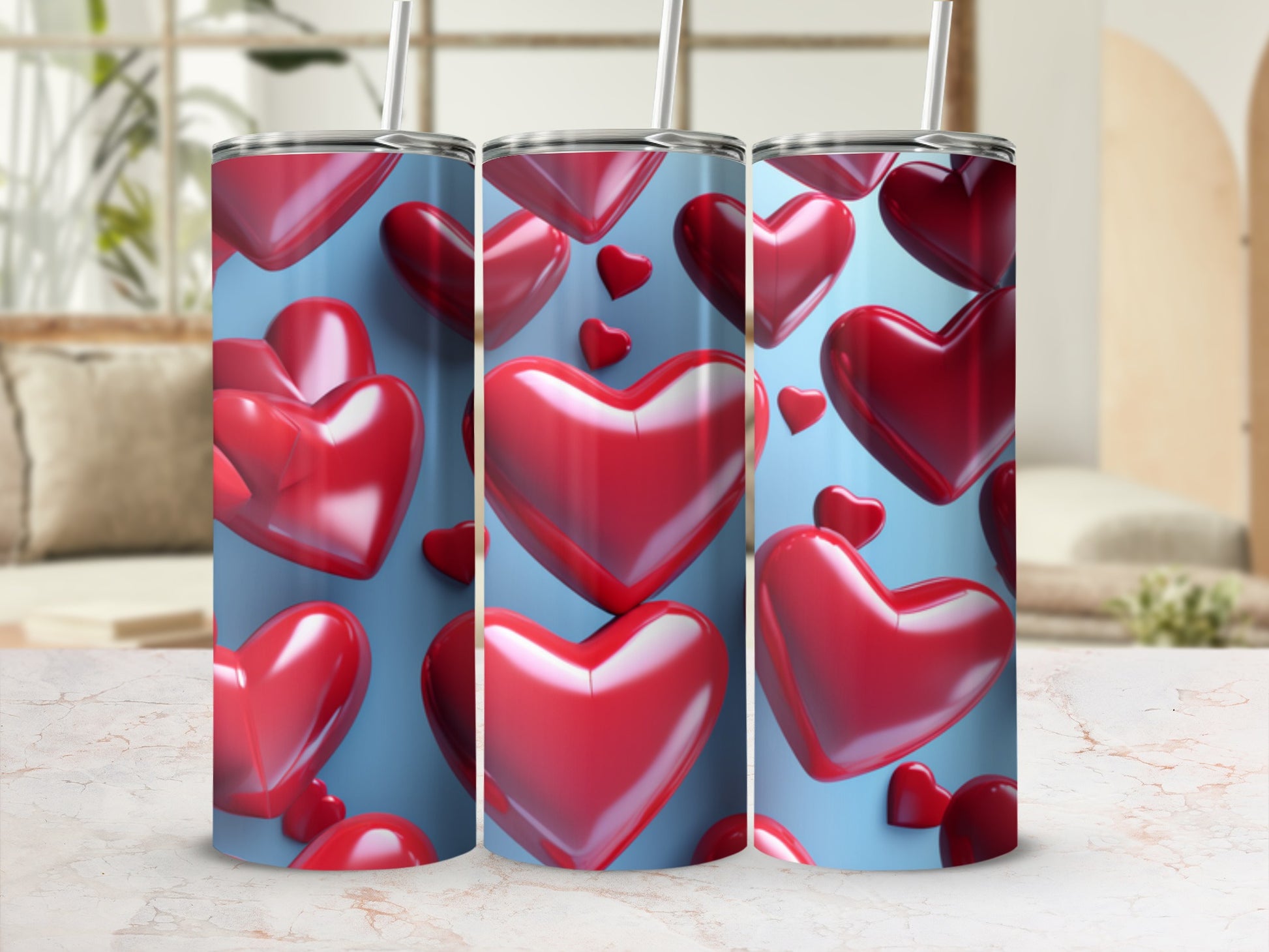 Three tumblers with a red heart pattern on a light blue background.