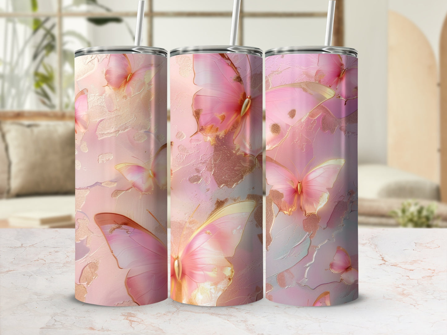 Pink butterflies and gold accents on a tumbler with a marble background.