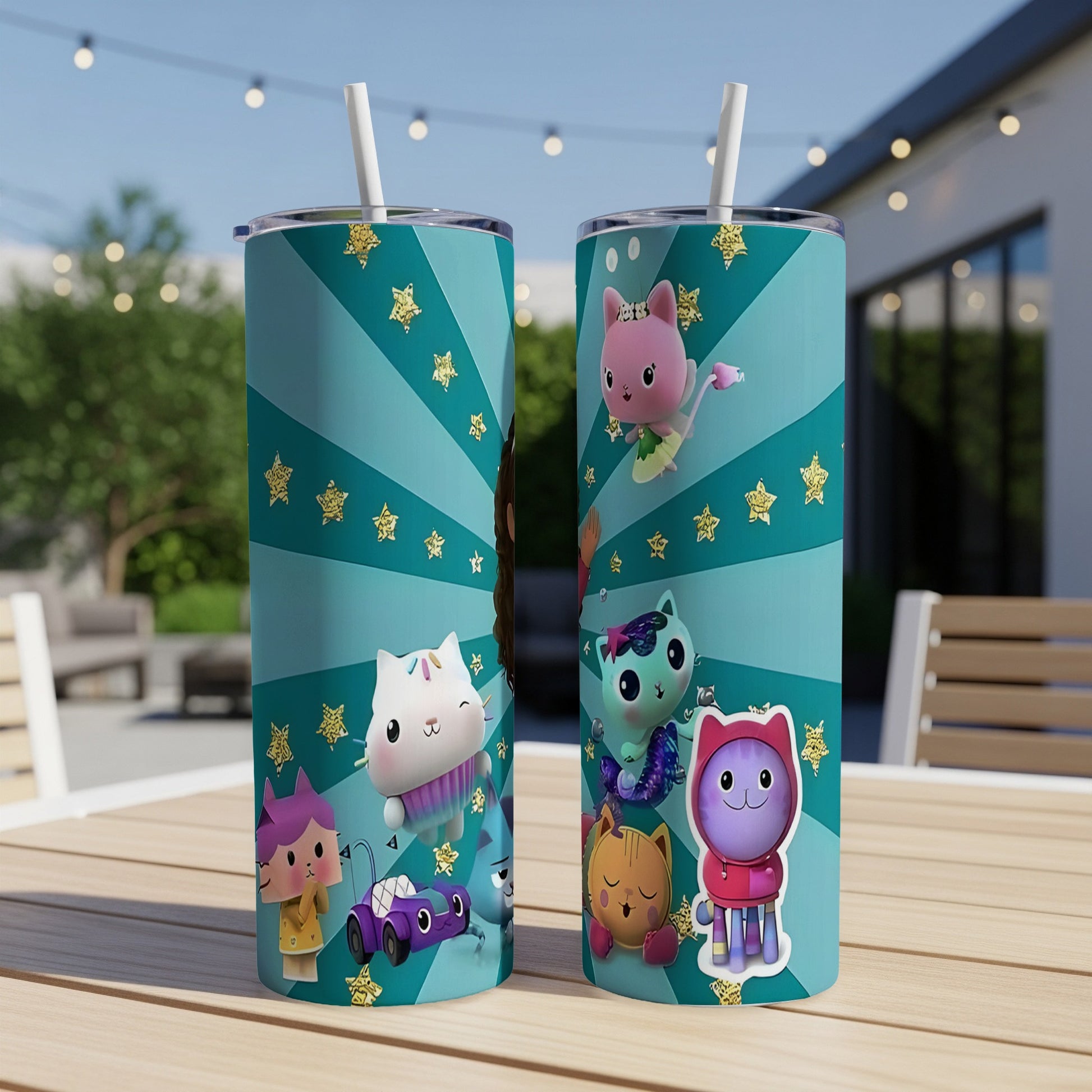 Two Gabby's Dollhouse tumblers with characters on a table.