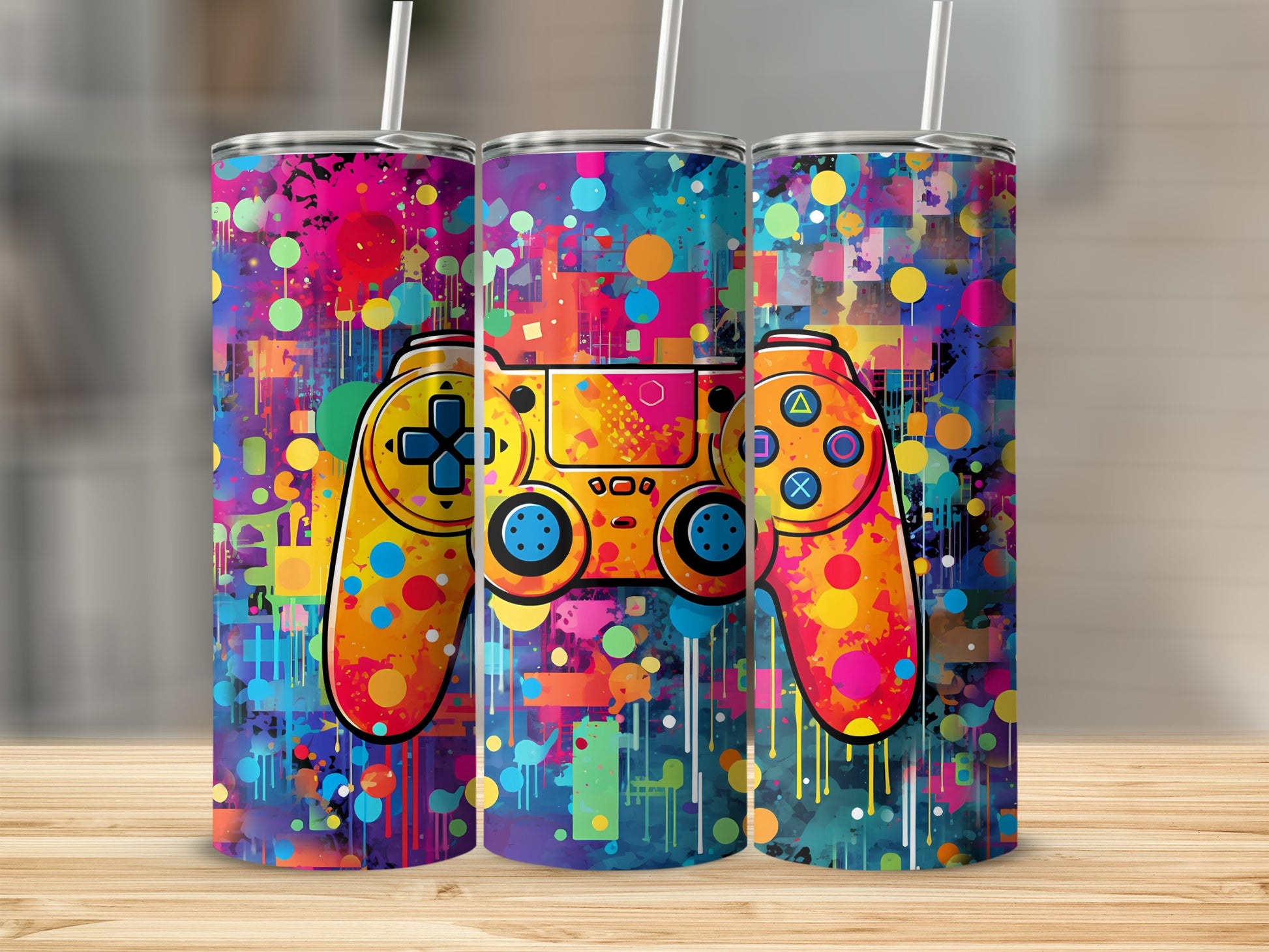 Three tumblers featuring a colorful abstract pattern with a video game controller.