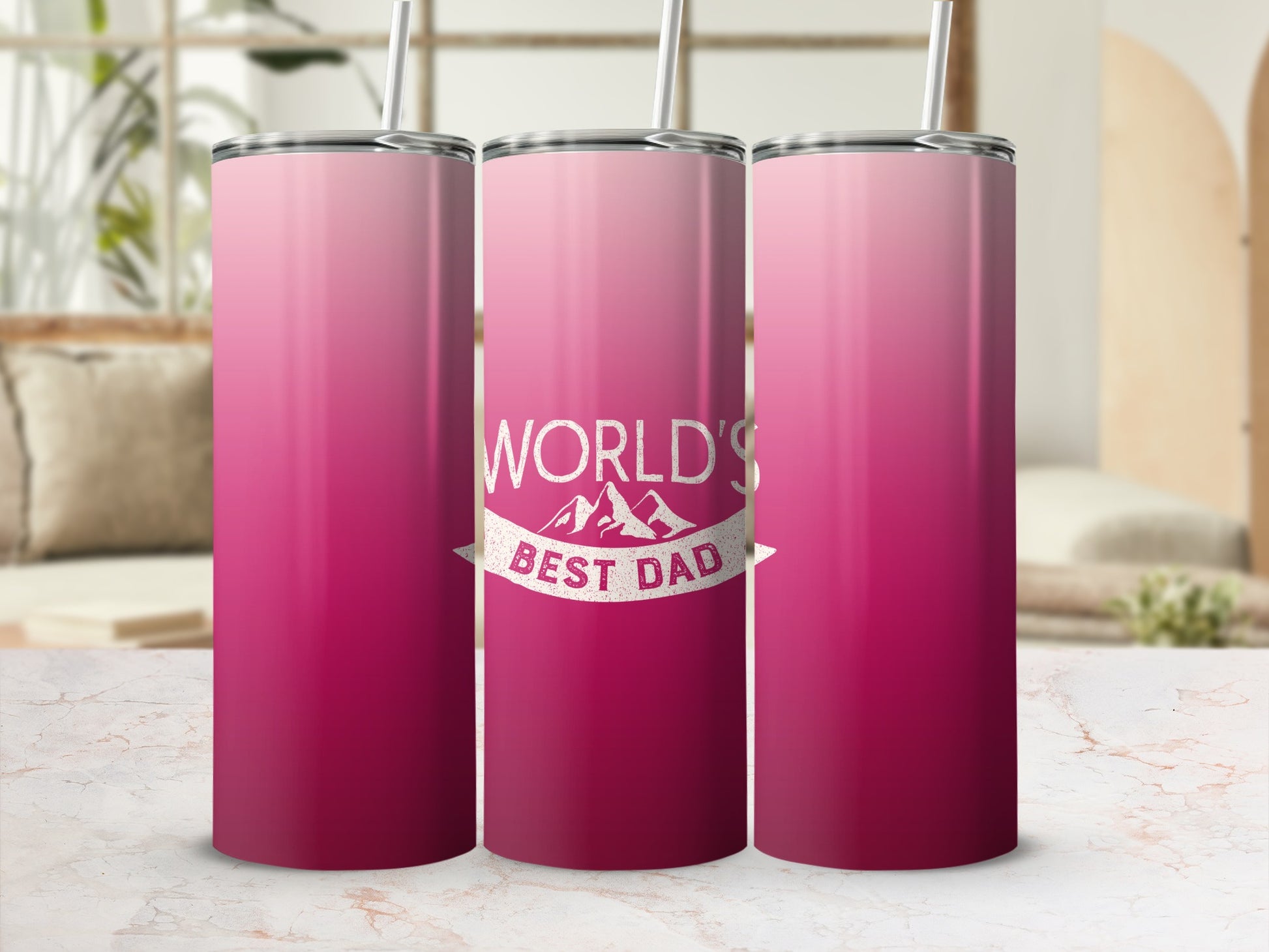 Pink gradient tumbler with "World's Best Dad" text and mountain graphic.