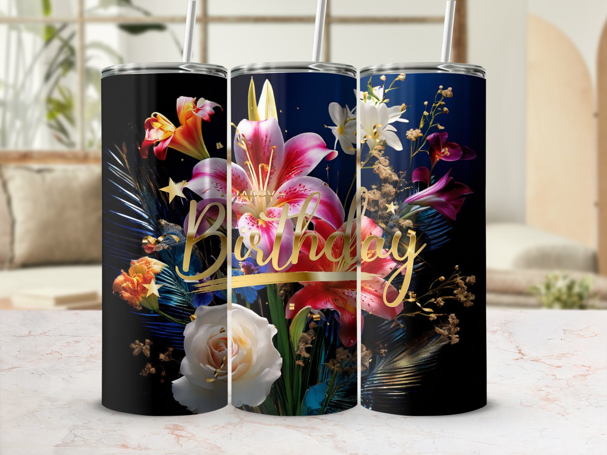 Tumbler with a gold "Happy Birthday" inscription and vibrant floral arrangement.