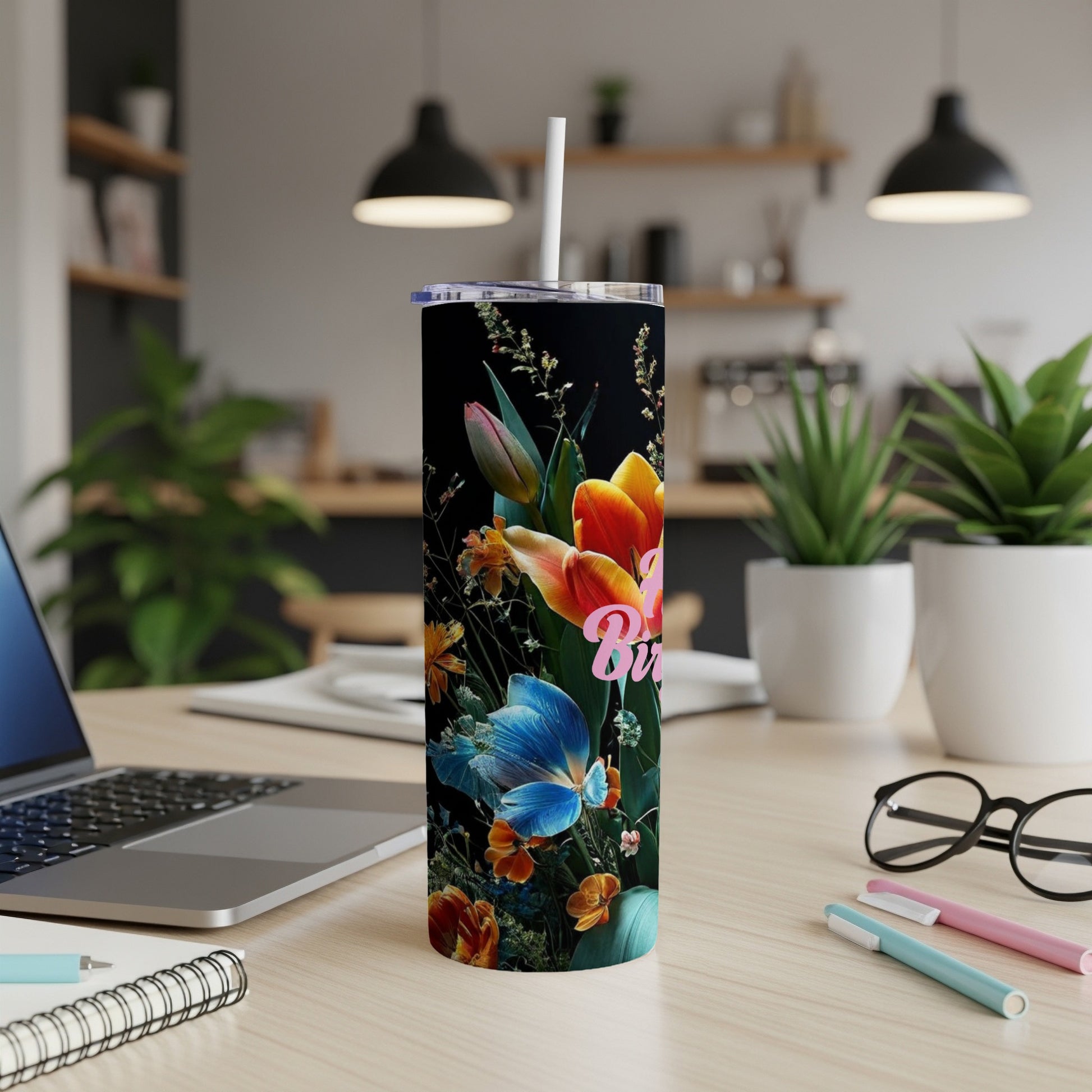 Tall tumbler with colorful floral pattern and pink "Happy Birthday" text.