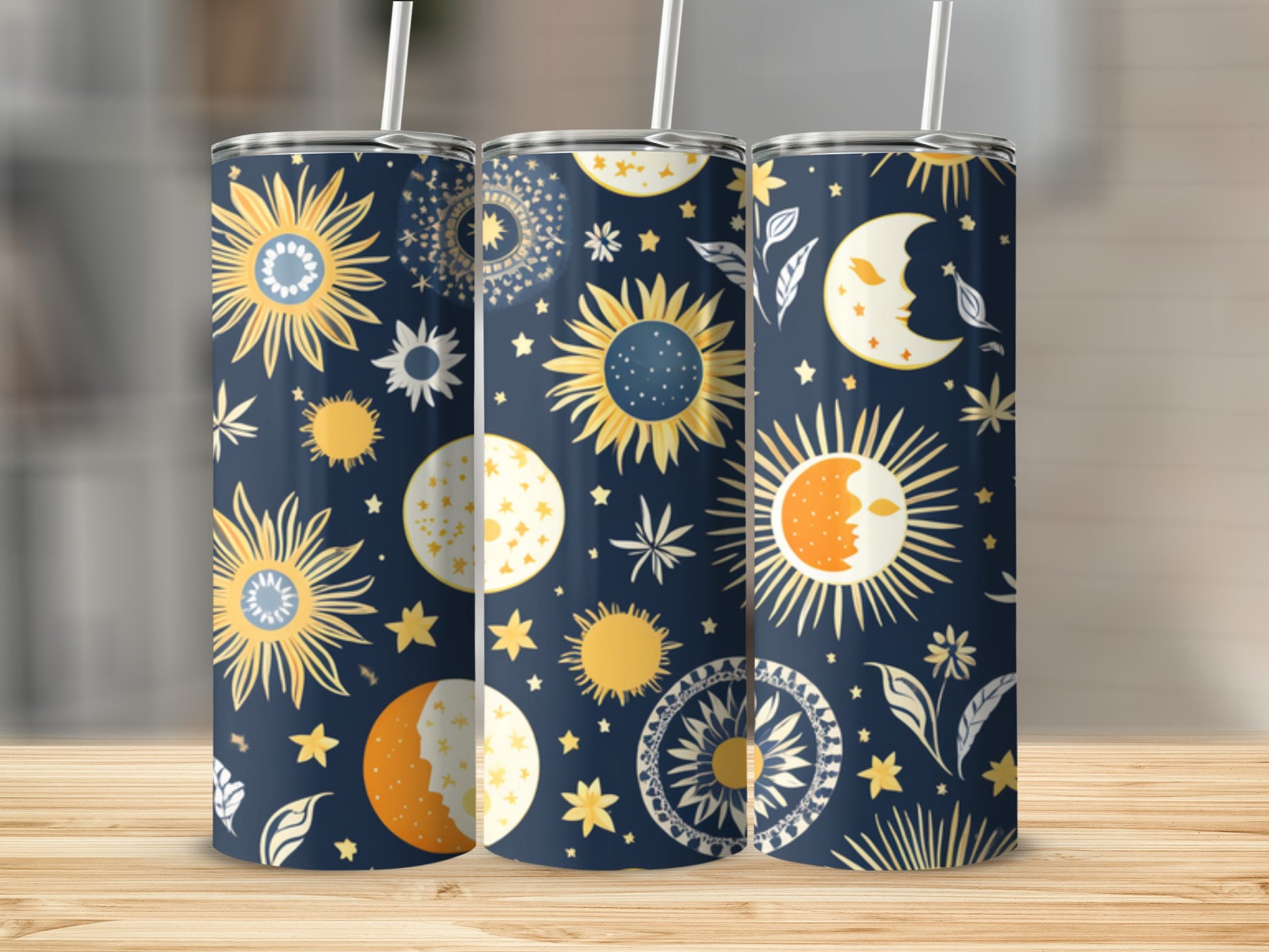 Three celestial-themed tumblers with sun, moon, and star patterns.