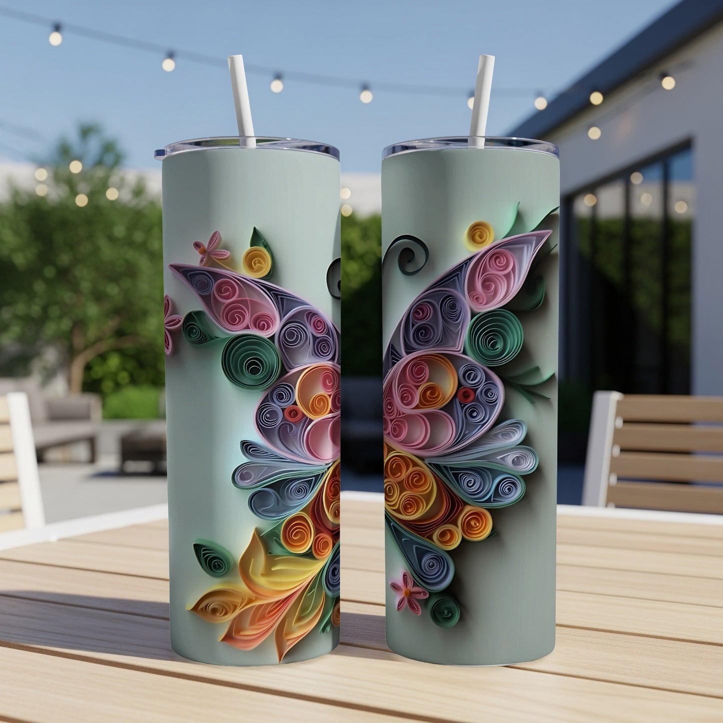Two tumblers with colorful quilled butterfly and floral designs on a pastel background.