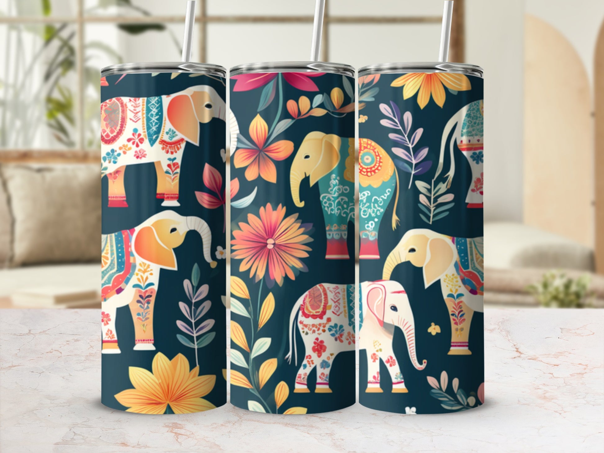 Three tumblers with colorful floral elephant designs.