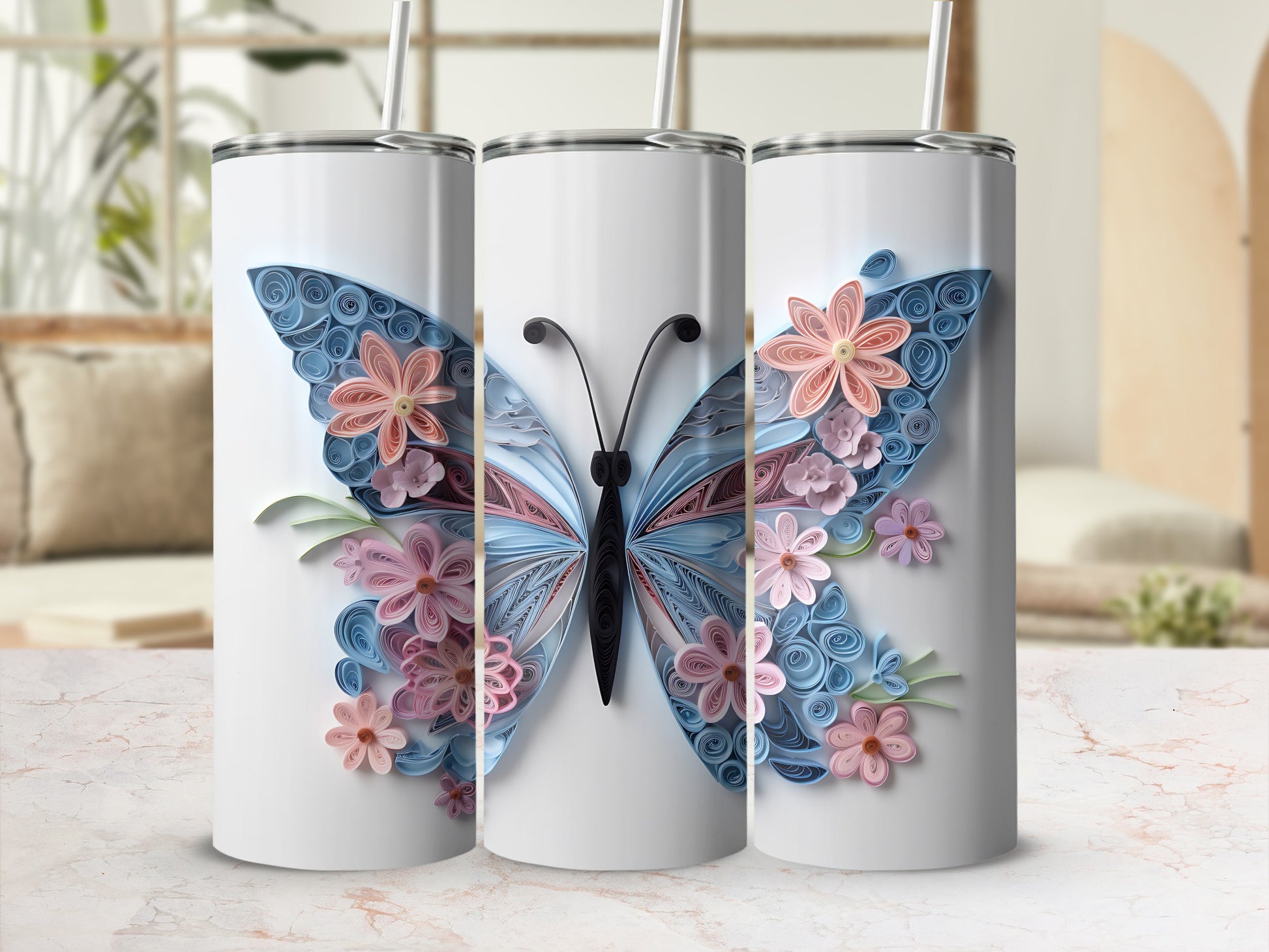 Three white tumblers featuring a blue and pink quillted butterfly design with flowers.