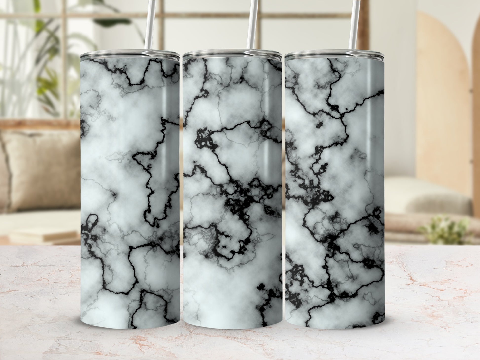Three tumblers with a black and white marble pattern.
