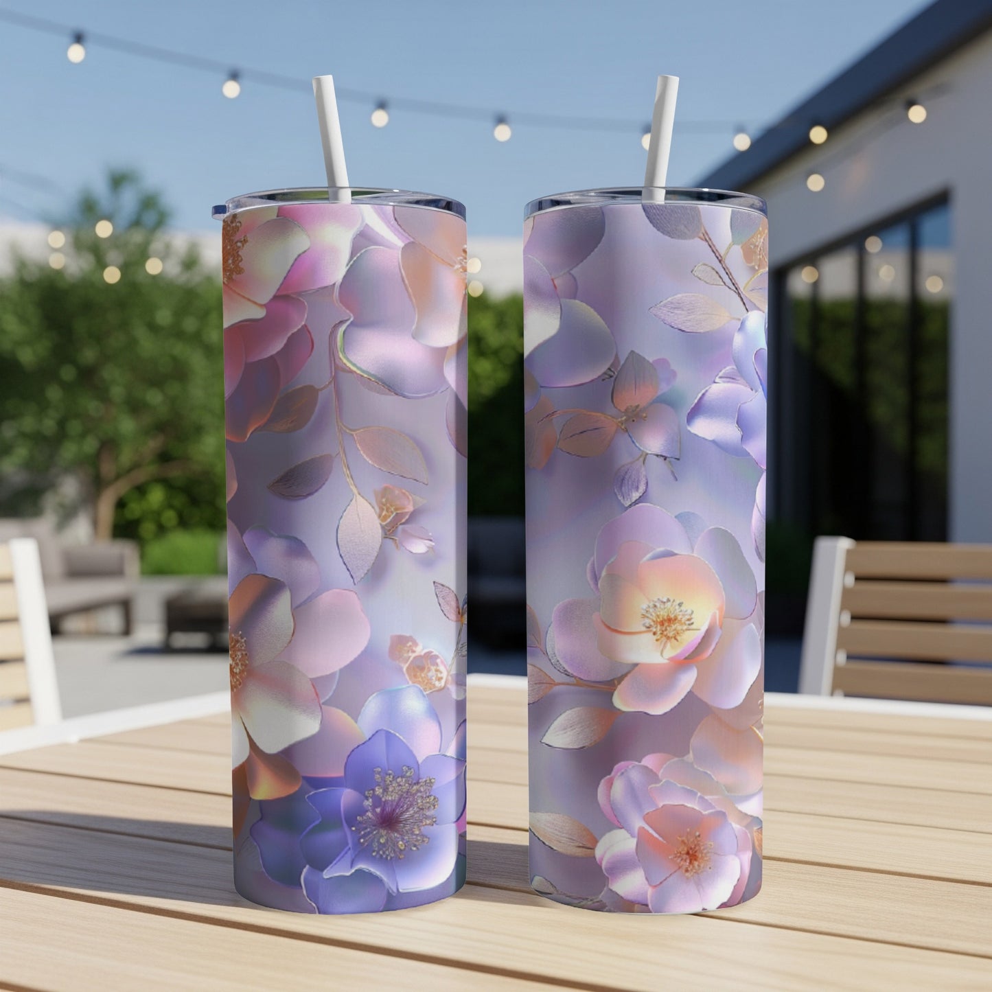 Two tumblers with floral pattern on a wooden table.