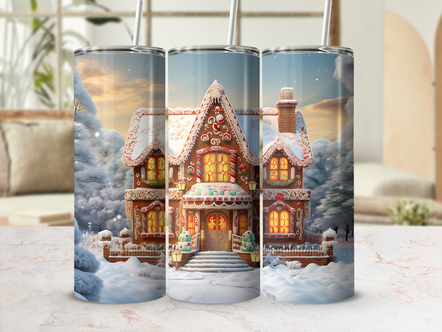 Three tumblers display a festive gingerbread house design in a snowy winter landscape.