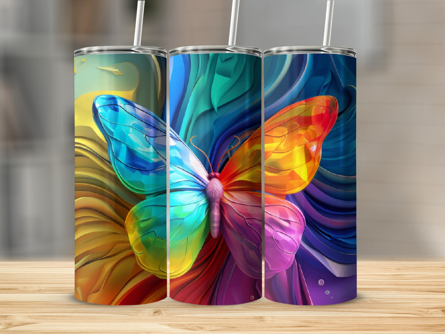 Colorful butterfly design on three tumblers.