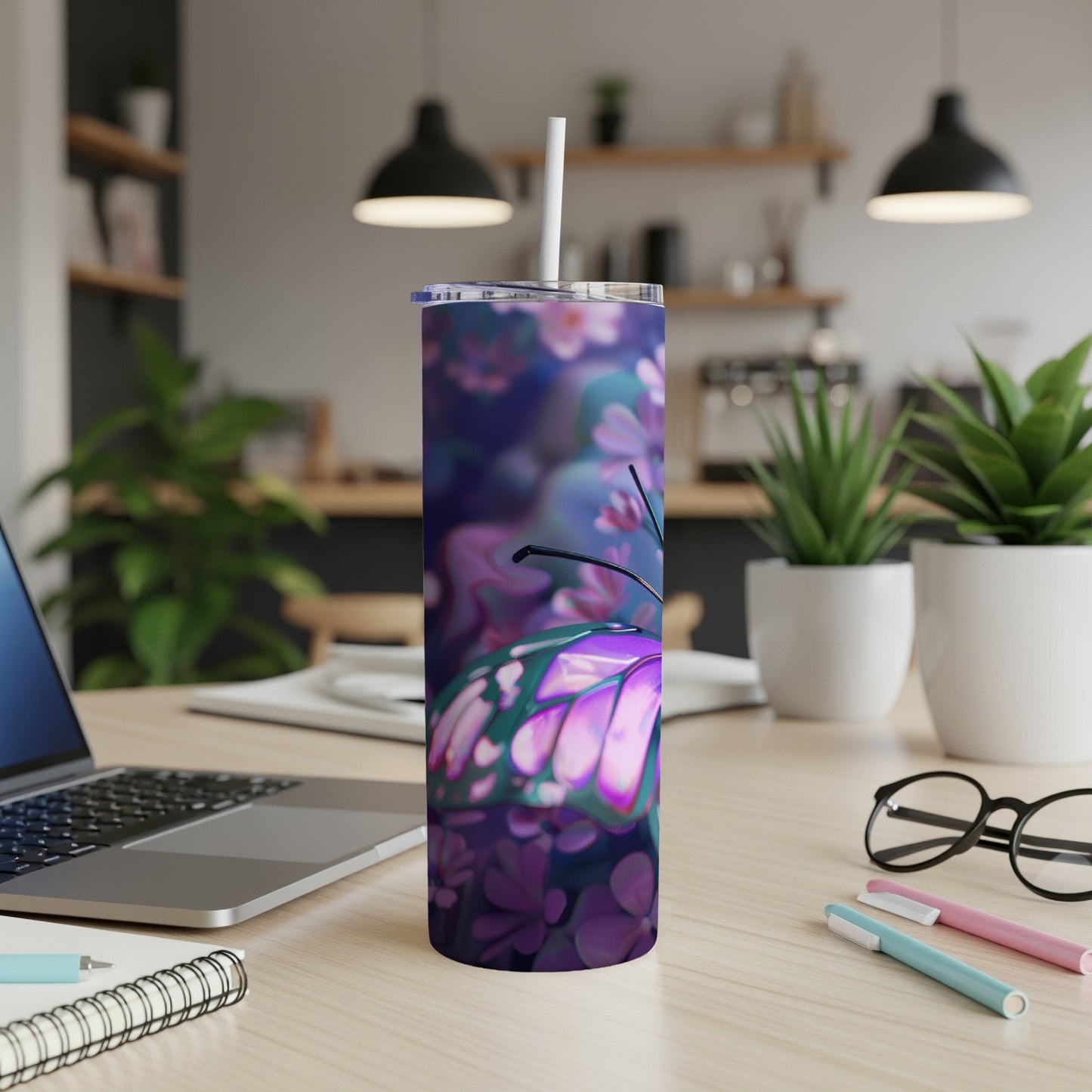 Purple butterfly design on a stainless steel tumbler with a white lid and straw.