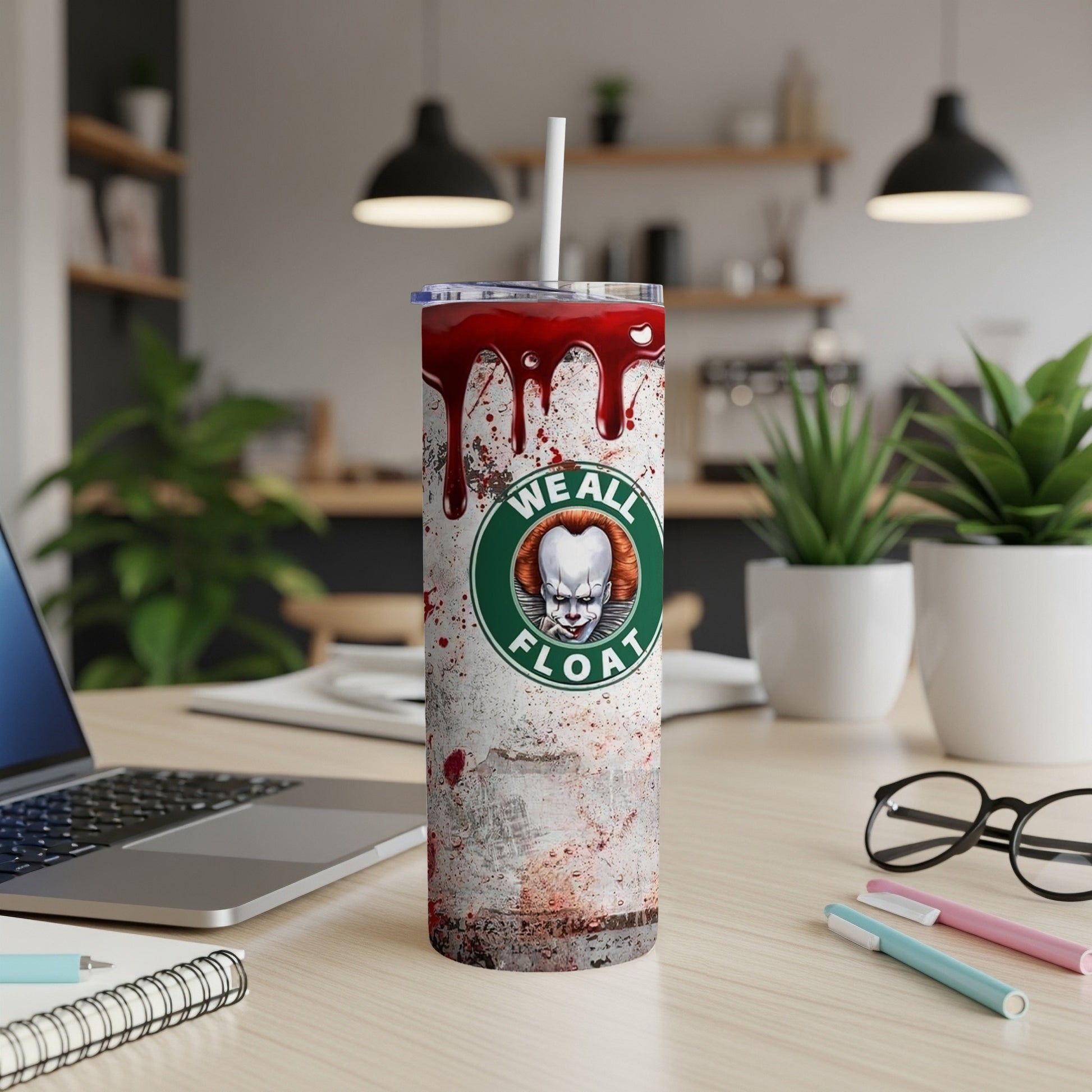 "We All Float" tumbler with Pennywise the clown and blood splatters.
