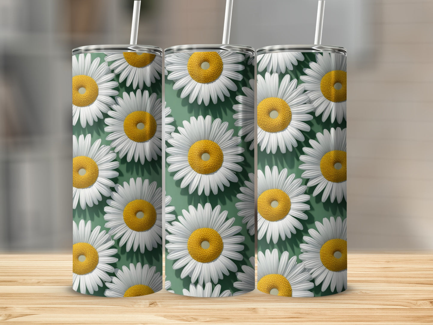 Three tumblers with a repeating daisy pattern on a wooden surface.