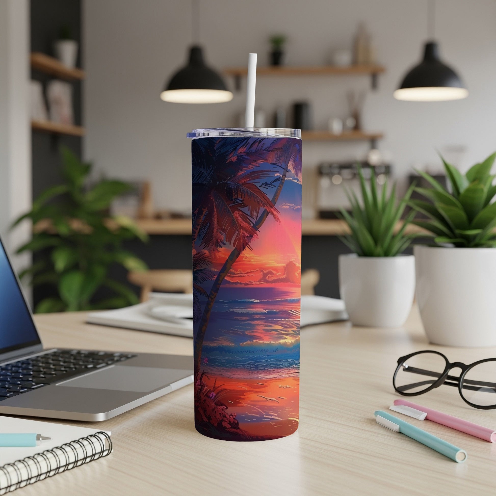 Tropical sunset art on a stainless steel tumbler with straw.