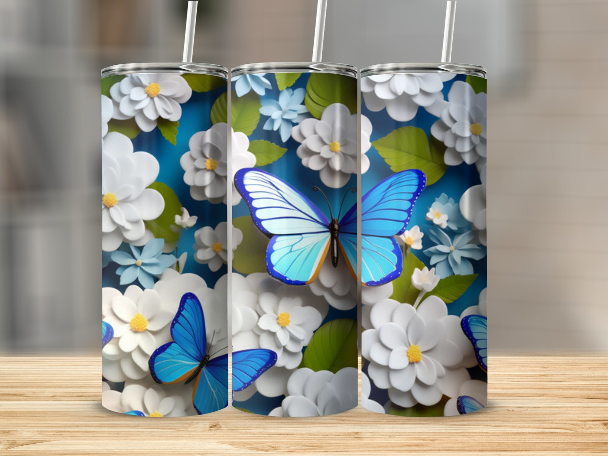 Blue butterfly and white floral pattern on a tumbler.