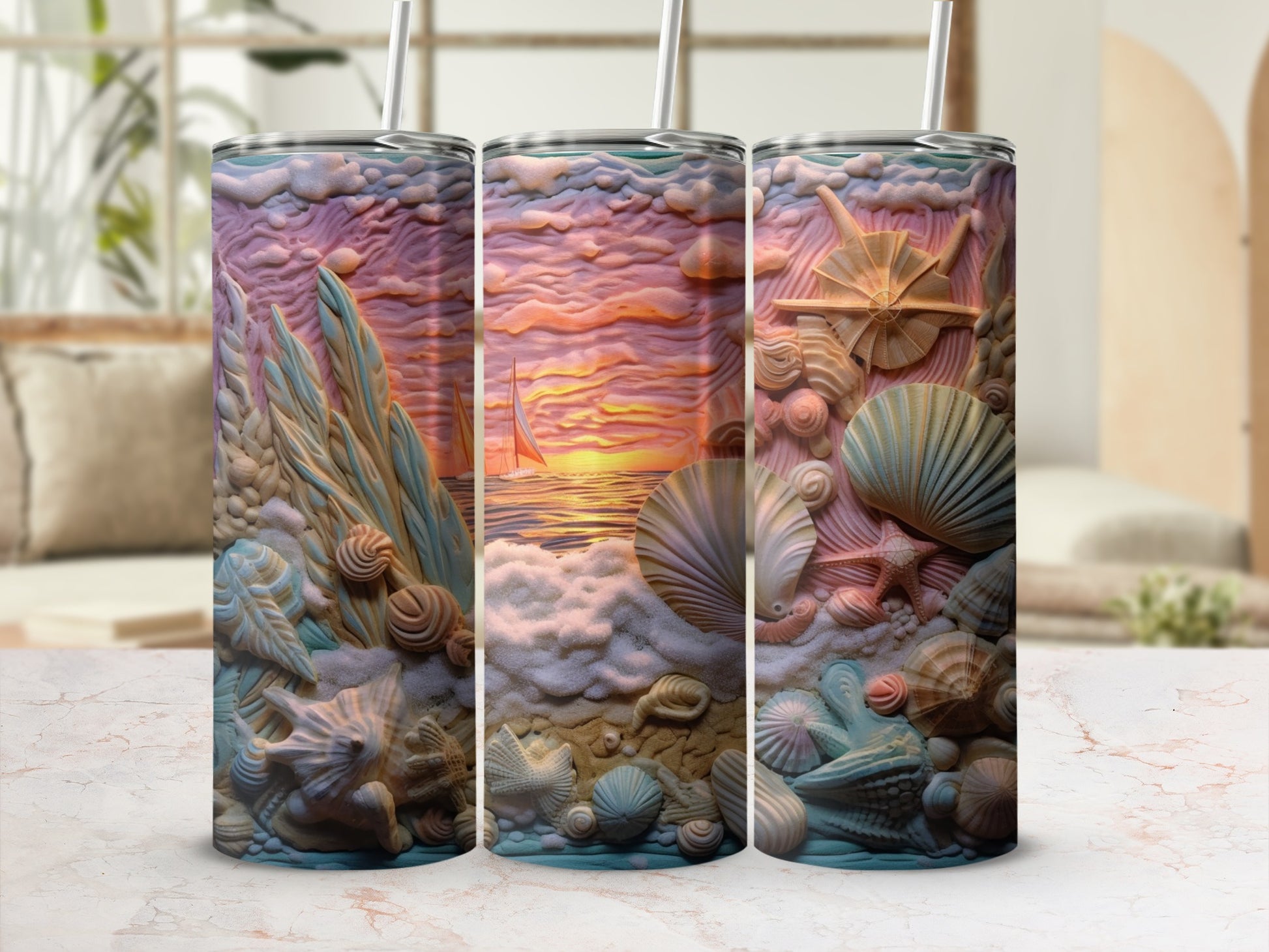 Three tumblers with embossed seashell and beach sunset designs.