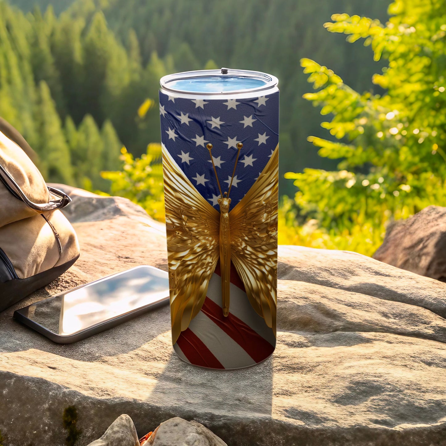 Gold butterfly with American flag wings on a tumbler.