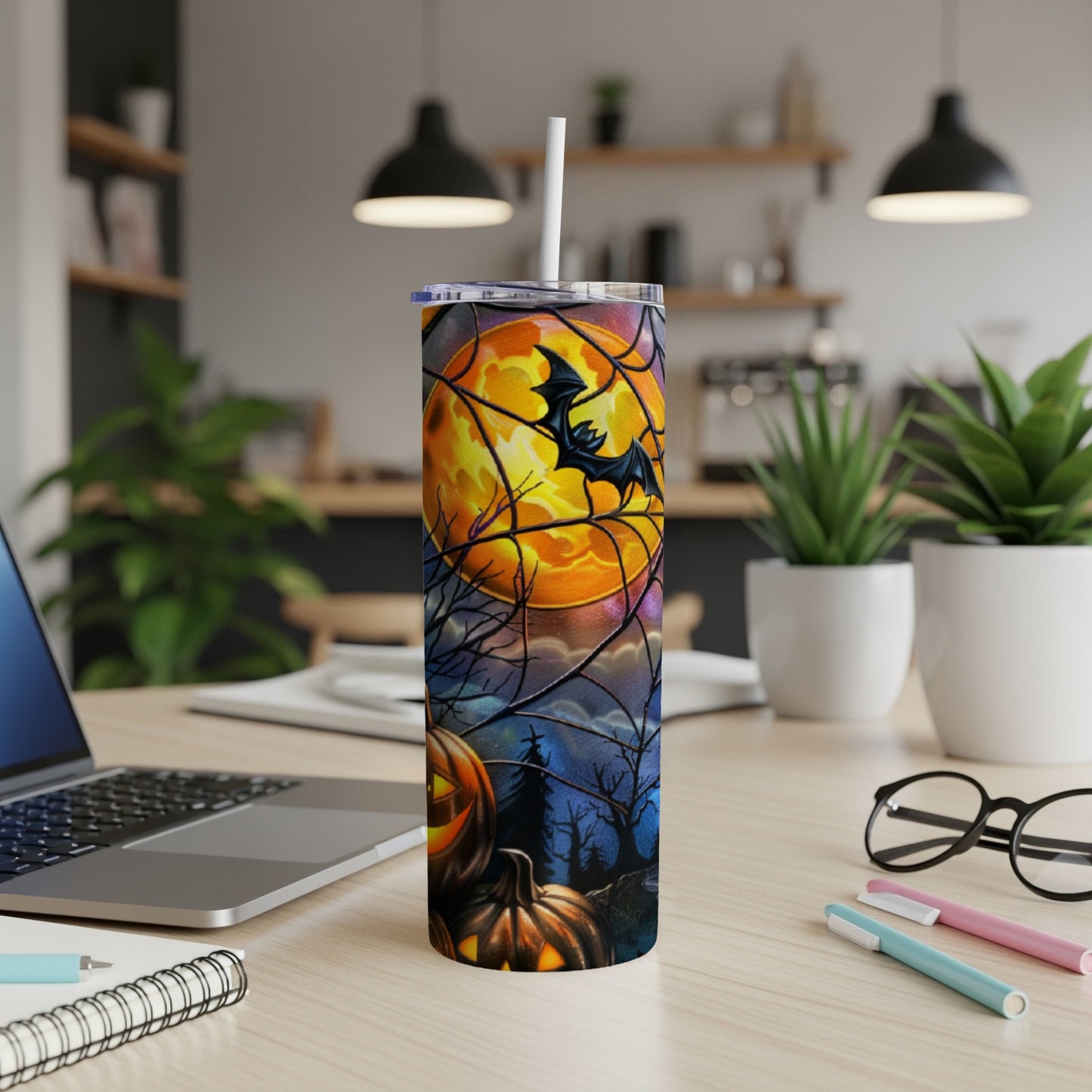 Halloween tumbler with pumpkins, bat, and moon.