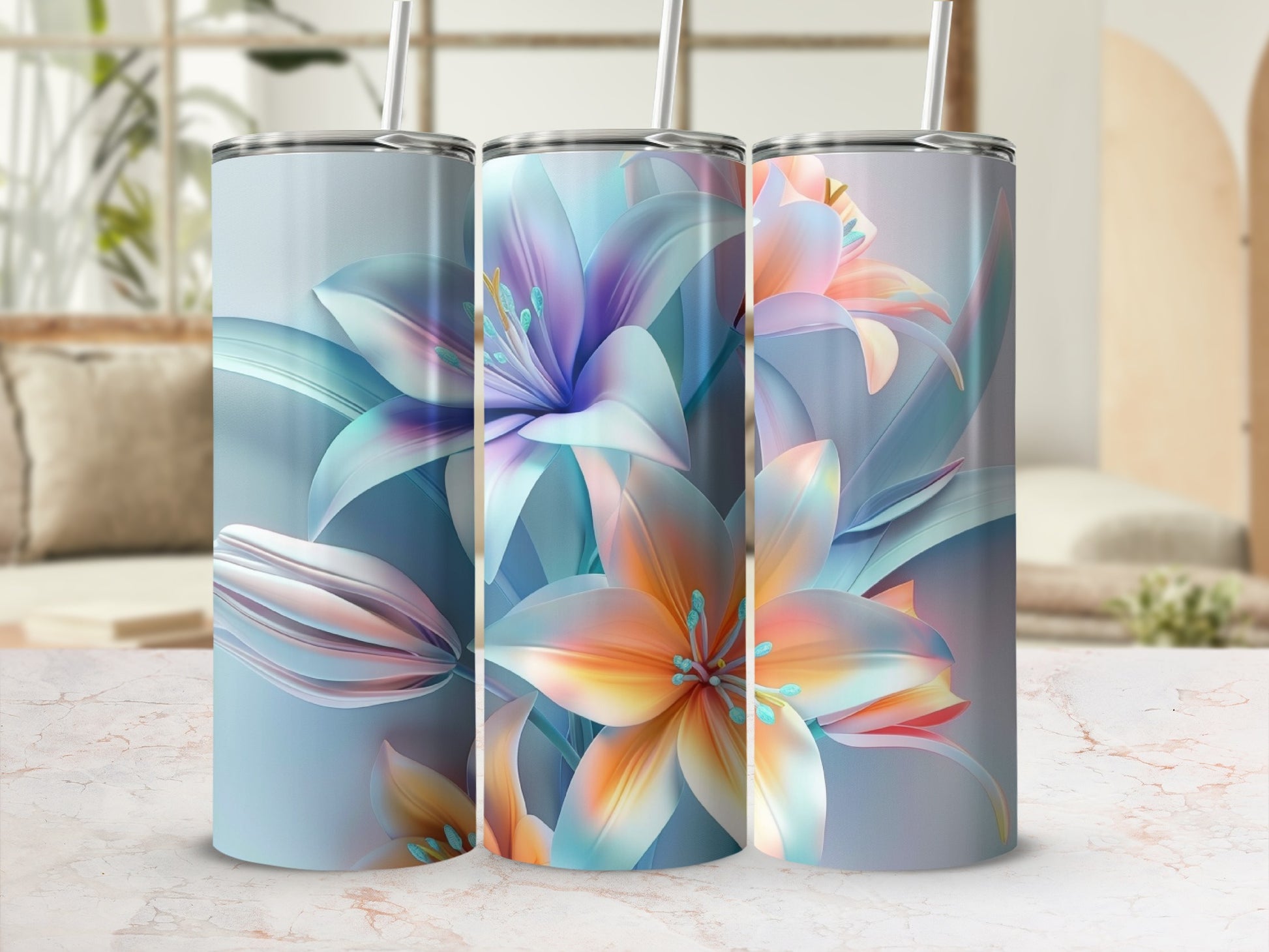 Three tumblers with colorful floral designs and straws.