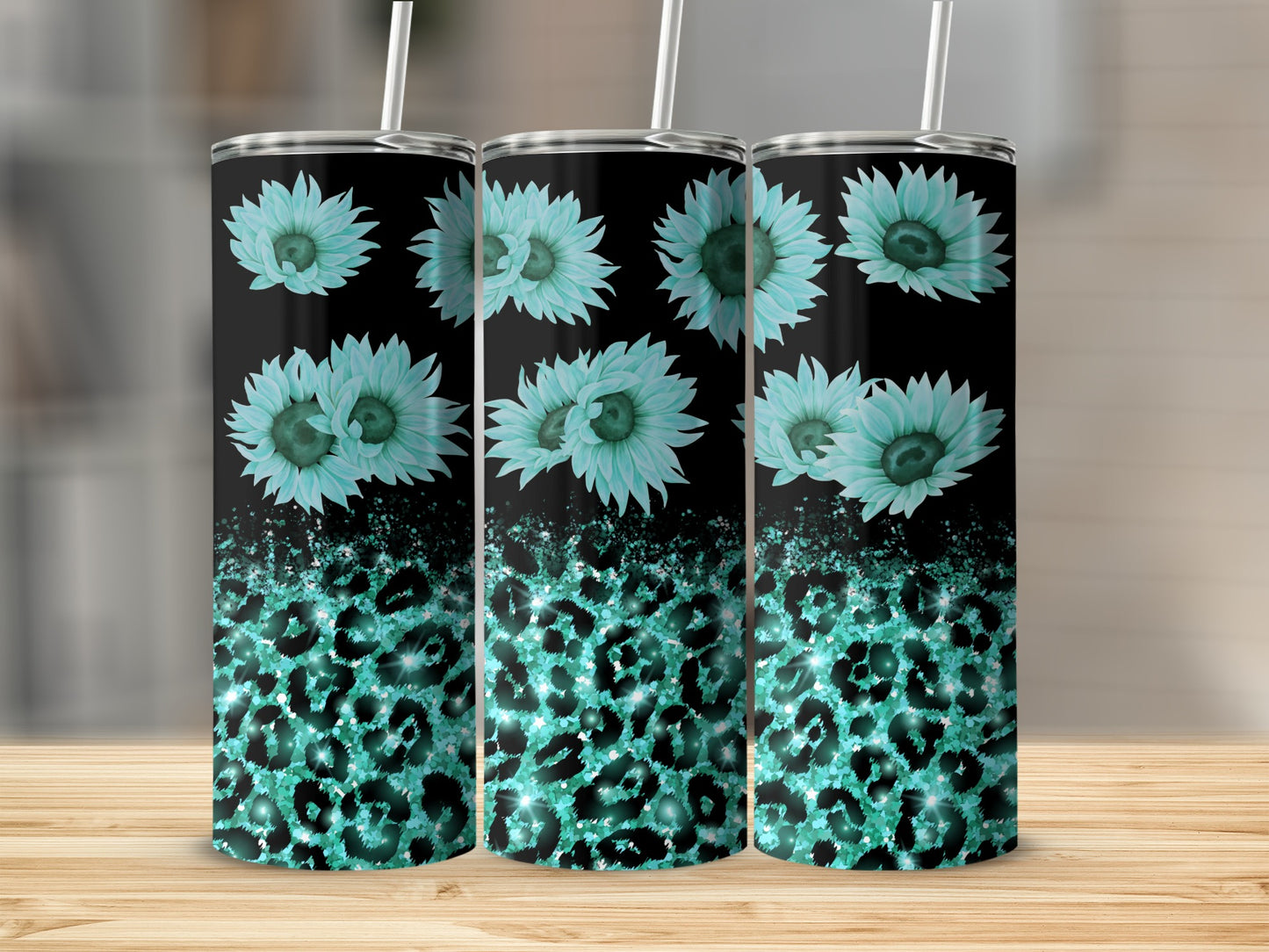 Three teal tumblers with floral and leopard print designs.