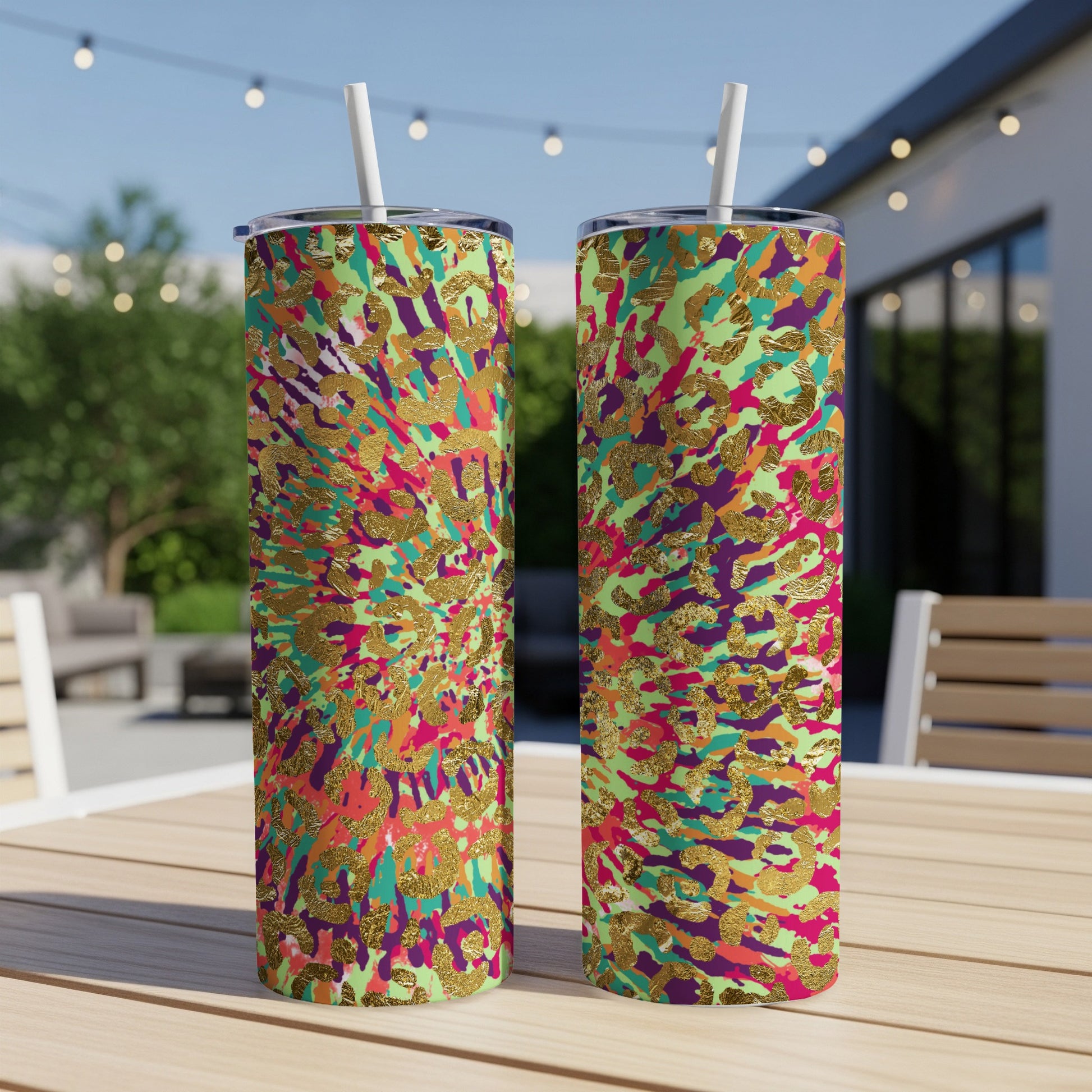 Two tumblers with a vibrant abstract animal print and gold foil accents.