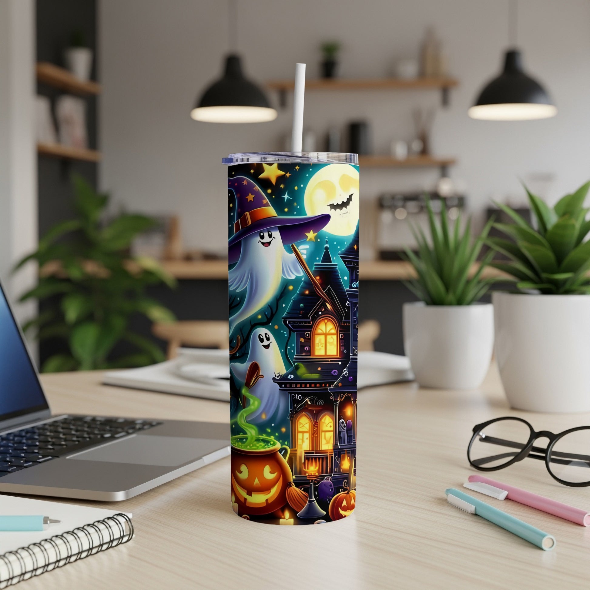 Halloween tumbler with ghosts, haunted house, pumpkin, and full moon design.