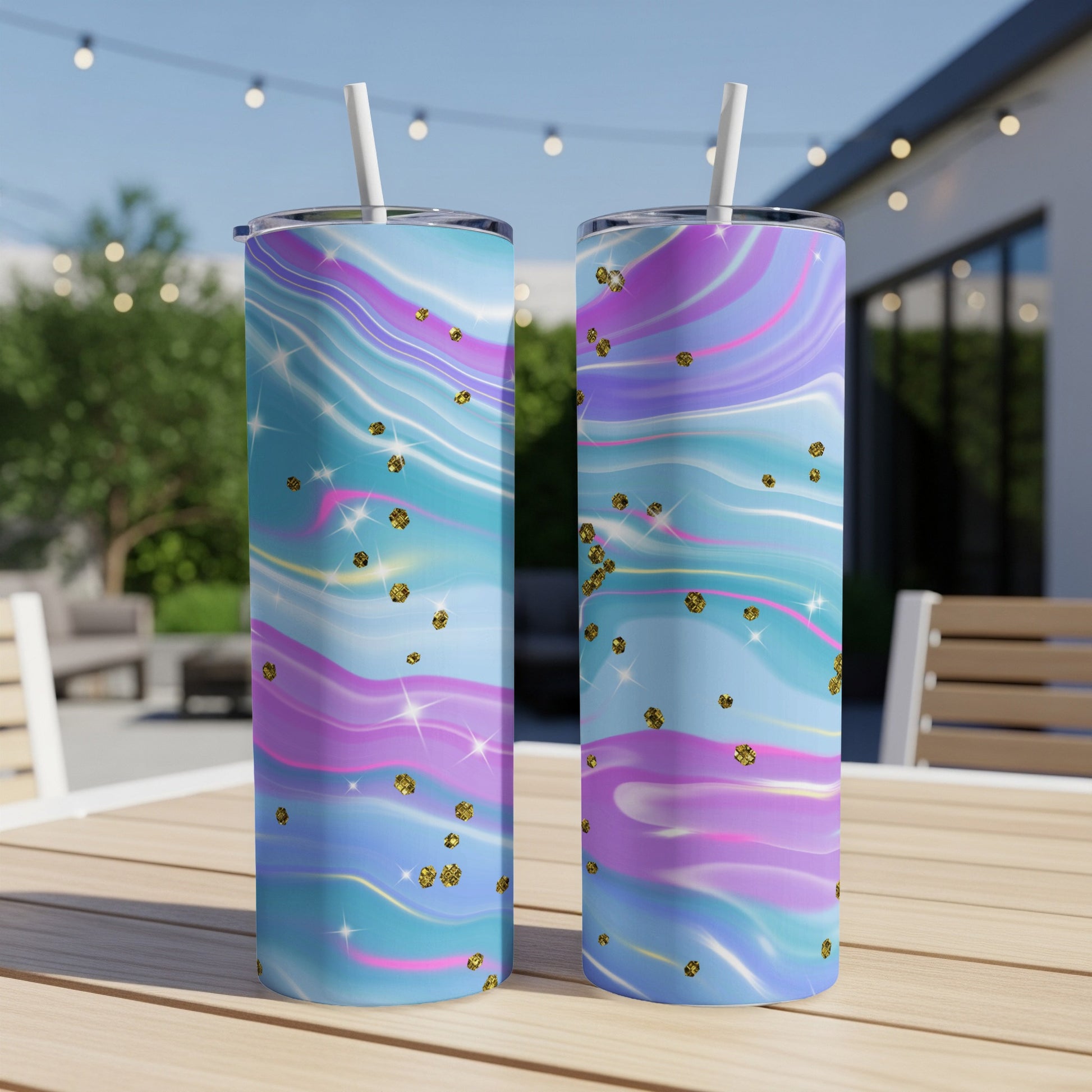 Two tall tumblers with swirled pink, purple, and blue design with gold glitter accents.
