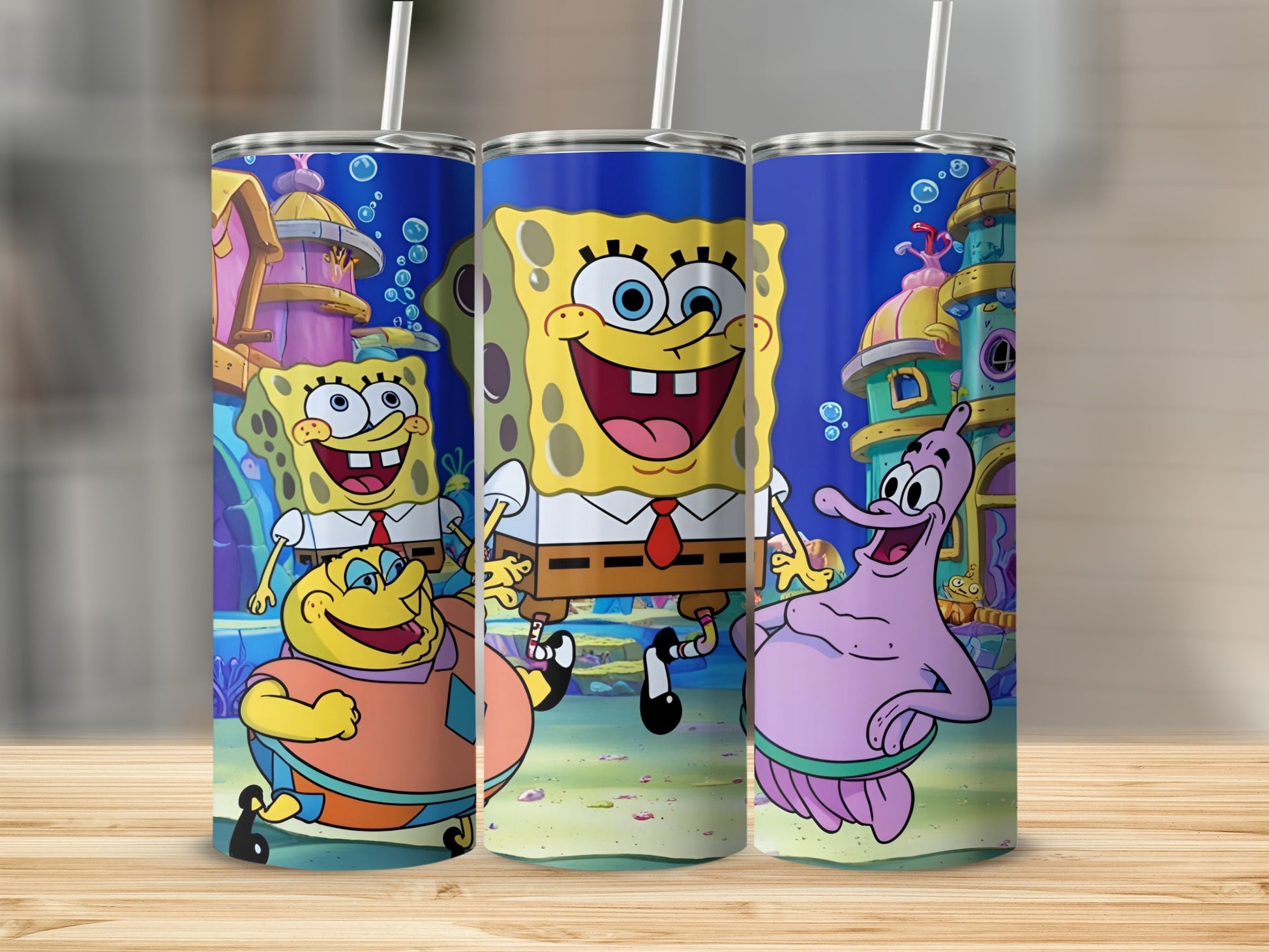 SpongeBob SquarePants, Patrick Star, and Squidward Tentacles characters on a blue tumbler.
