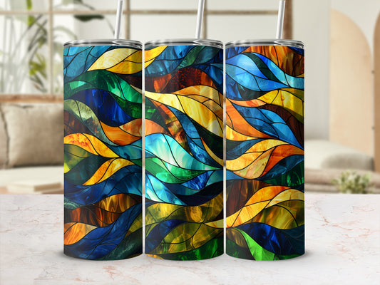 Three tumblers with a stained-glass wave pattern and straws.