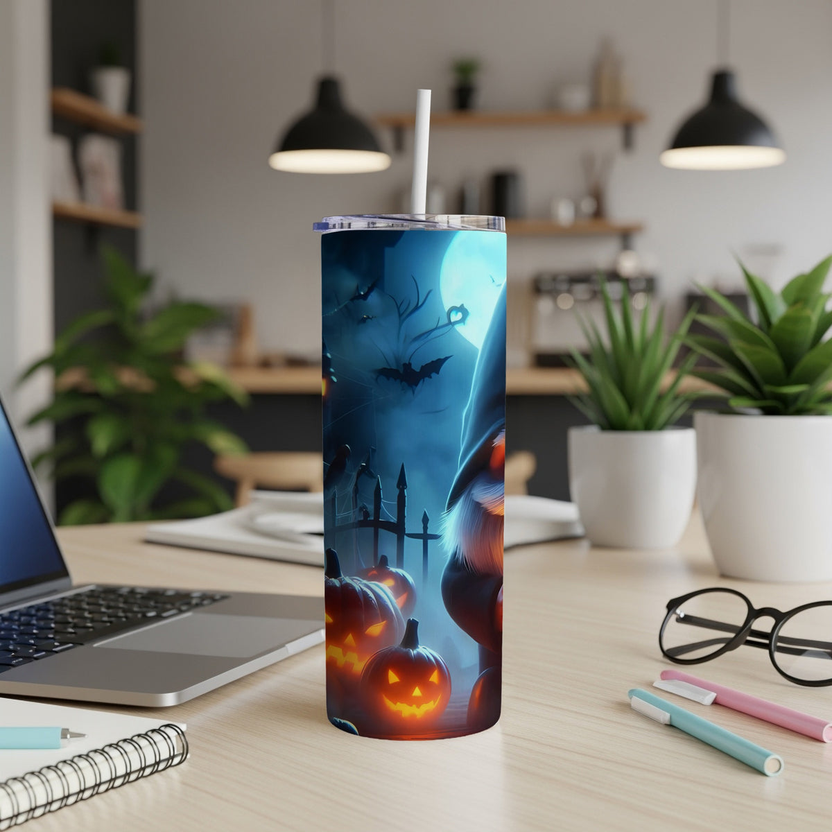 Halloween gnome with pumpkins and bats design on a tumbler with a straw.