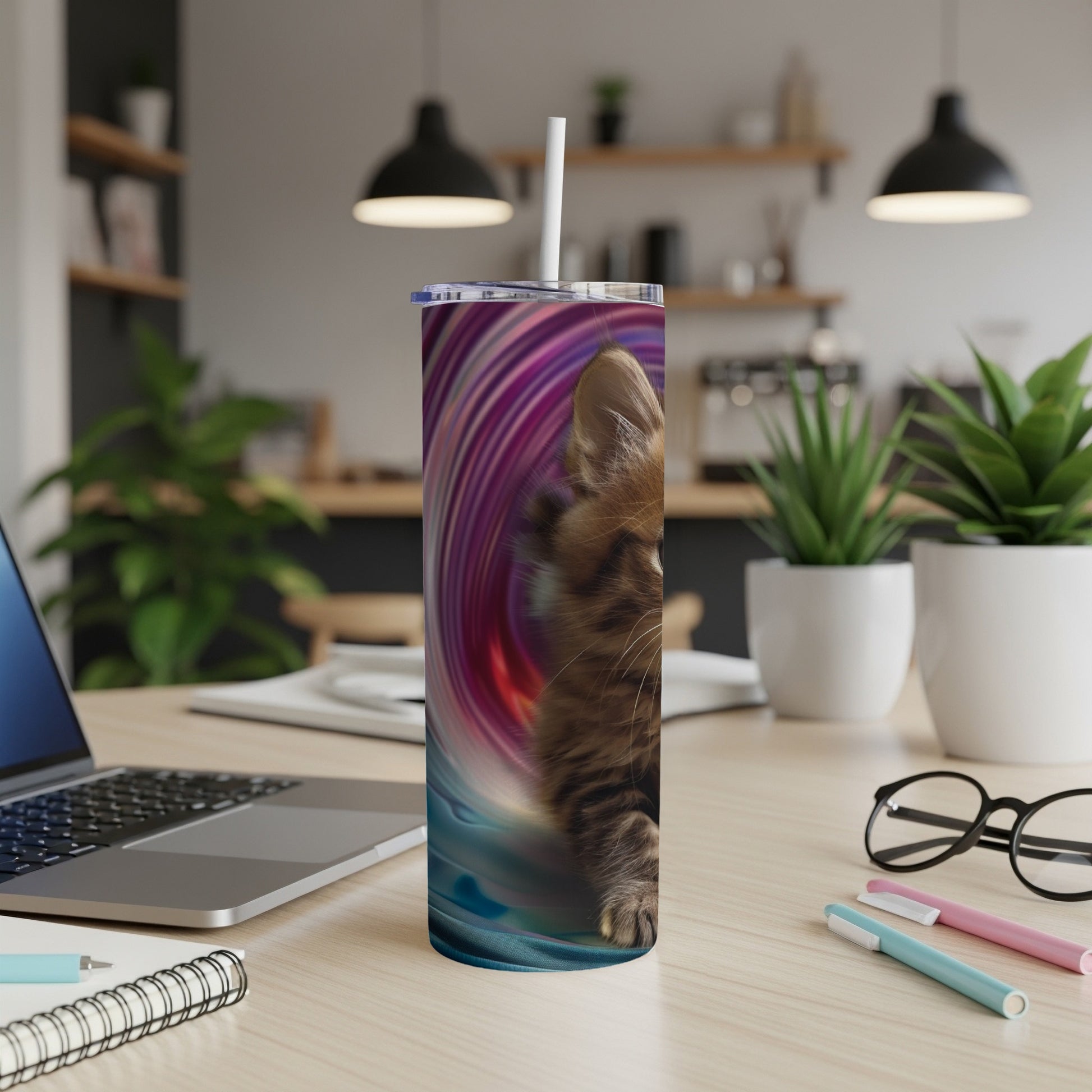 Brown tabby cat on a tumbler with a swirling colorful background.