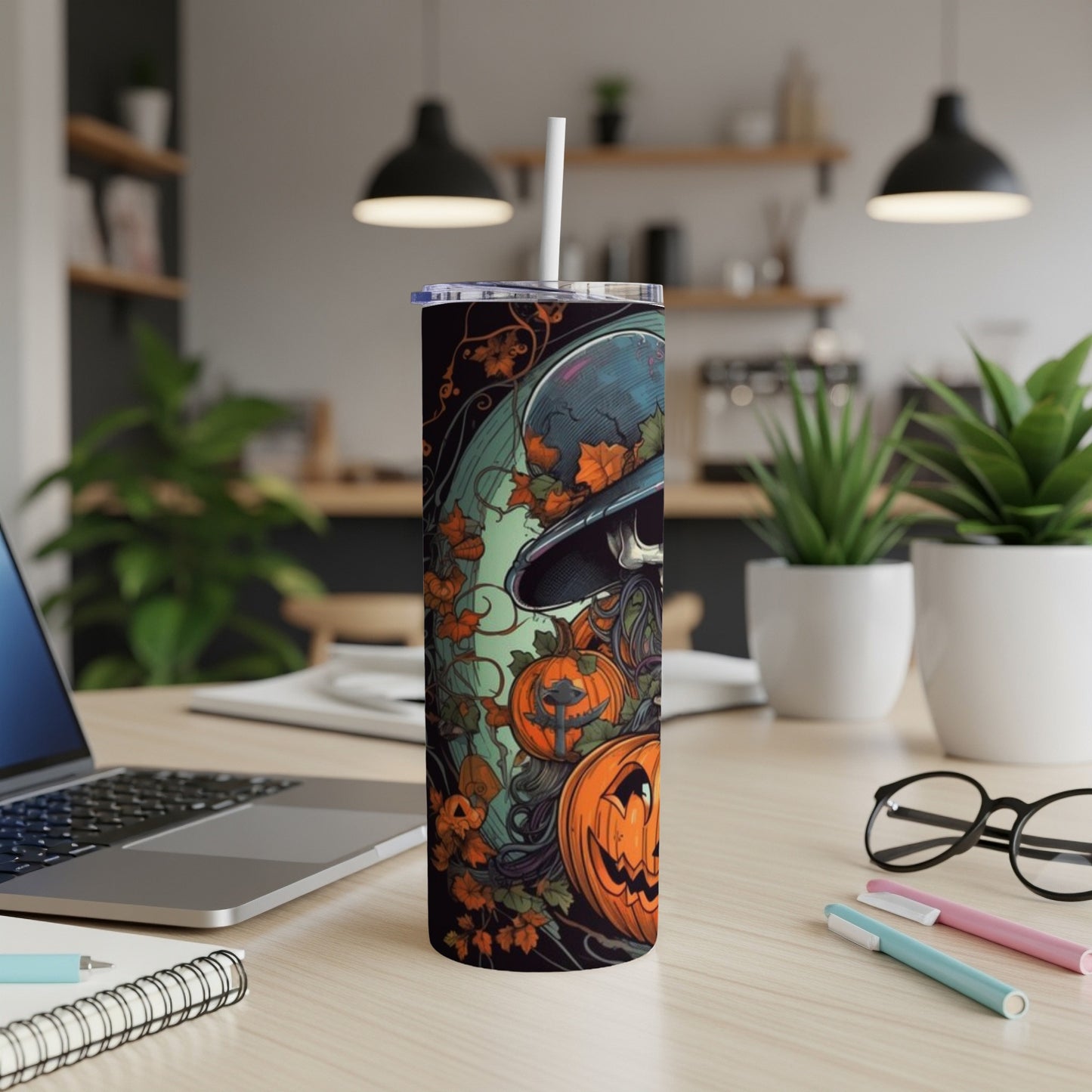 Tumbler with Halloween skull, pumpkins, and falling leaves design.