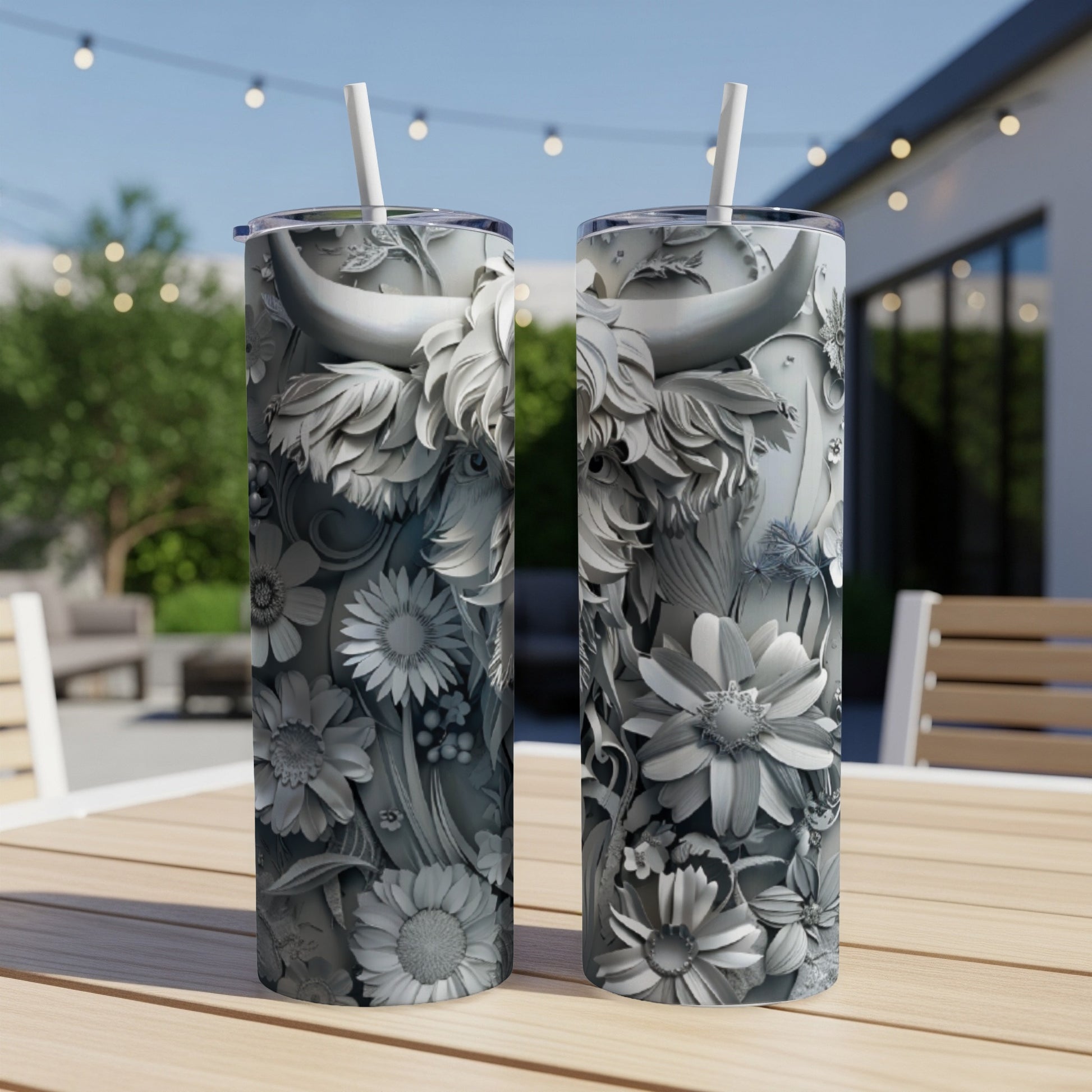 Two tall tumblers with embossed highland cow and floral design.