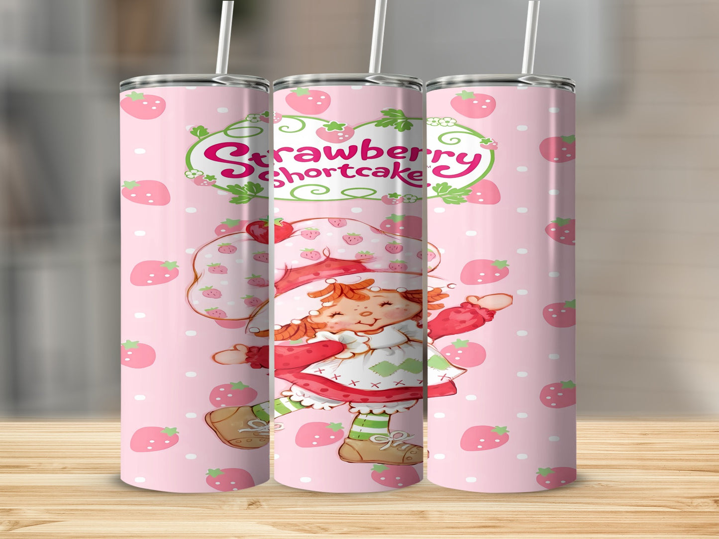 Strawberry Shortcake character with fruit pattern on pink tumblers.